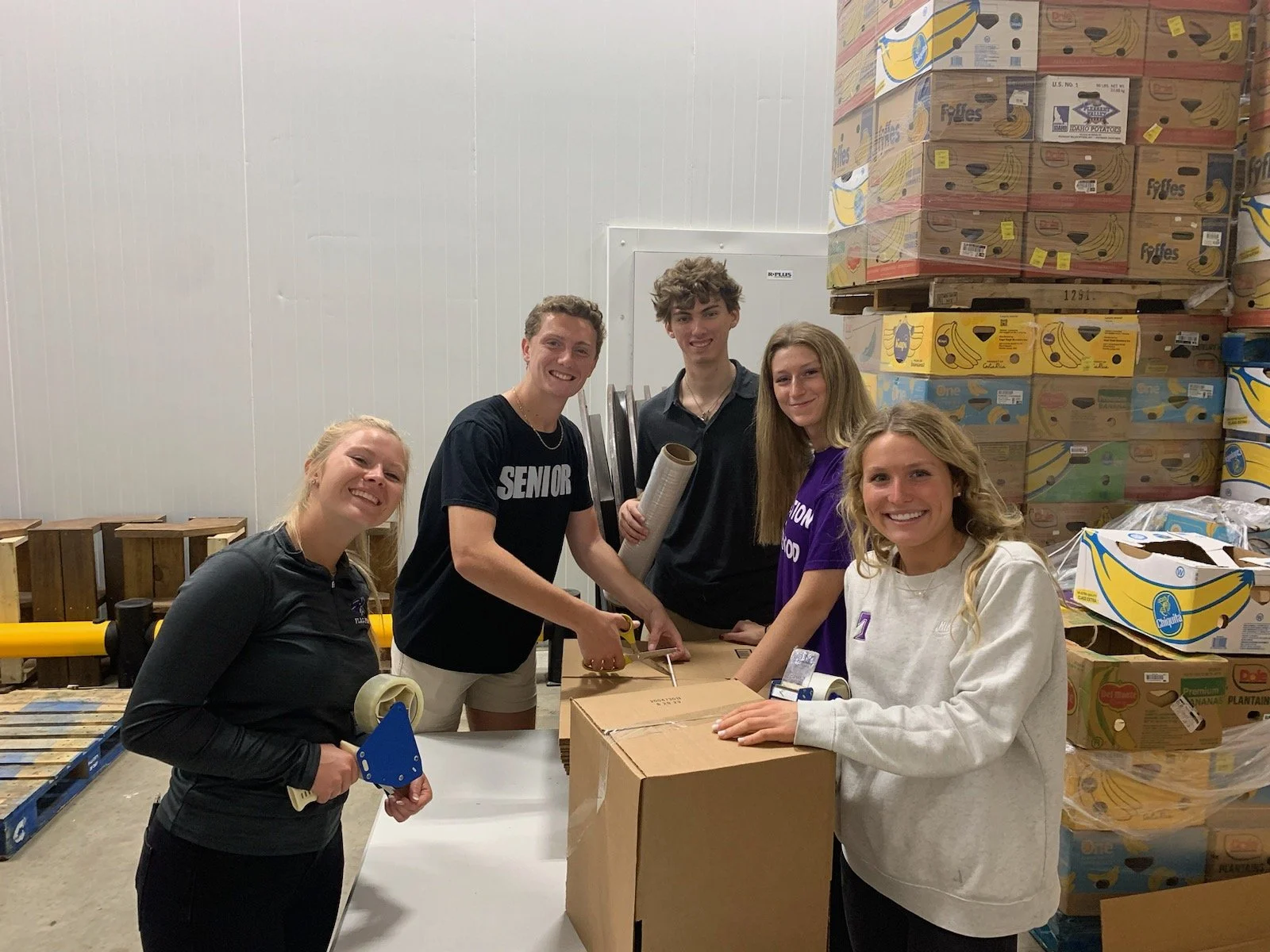 Chick-fil-A Leader Academy Build Food Relief Boxes