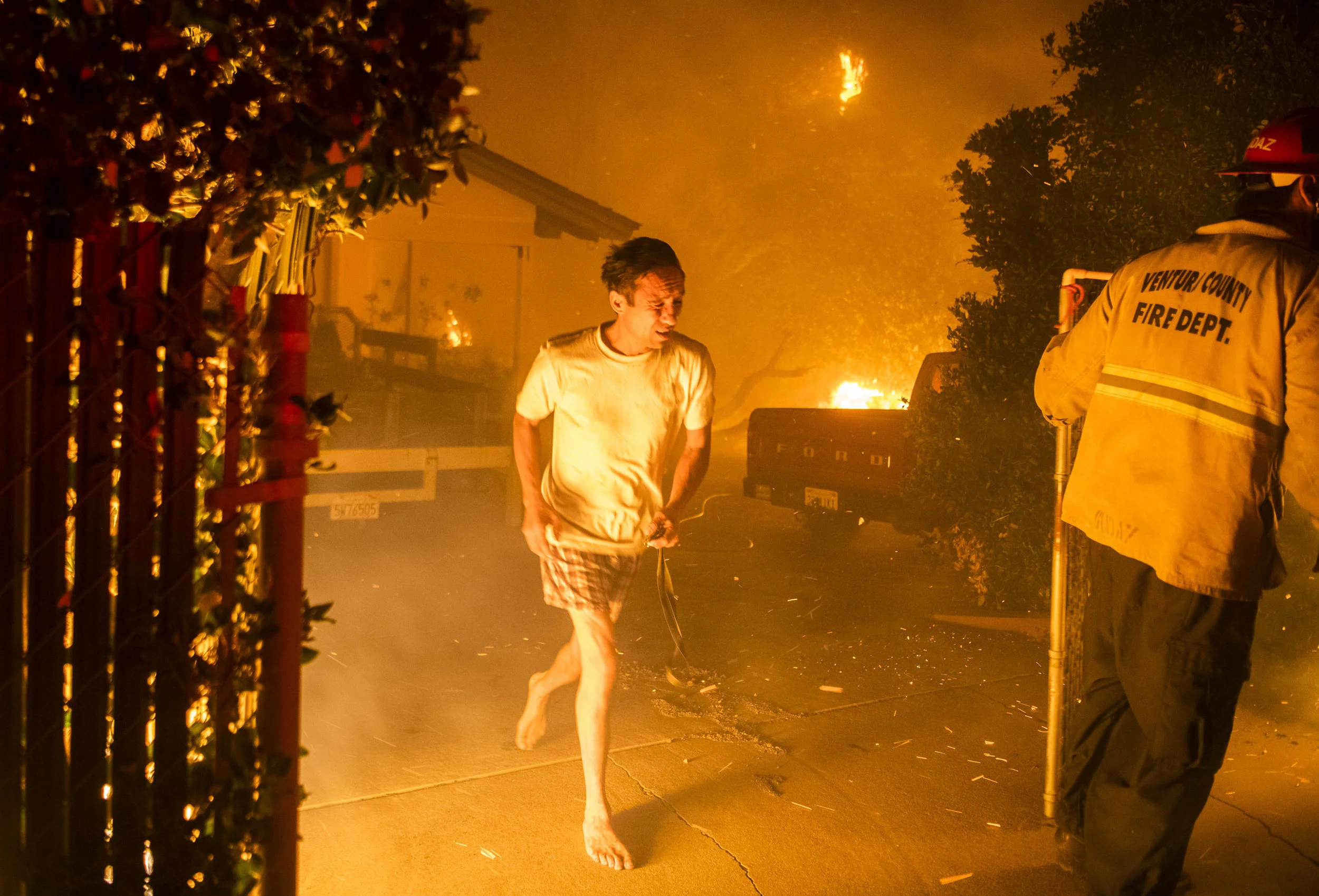 Masao Barrows flees for his life in his pajamas as the Woolsey Fire ignites his front yard and home in Thousand Oaks, approx. 2am, Friday November 9th.
