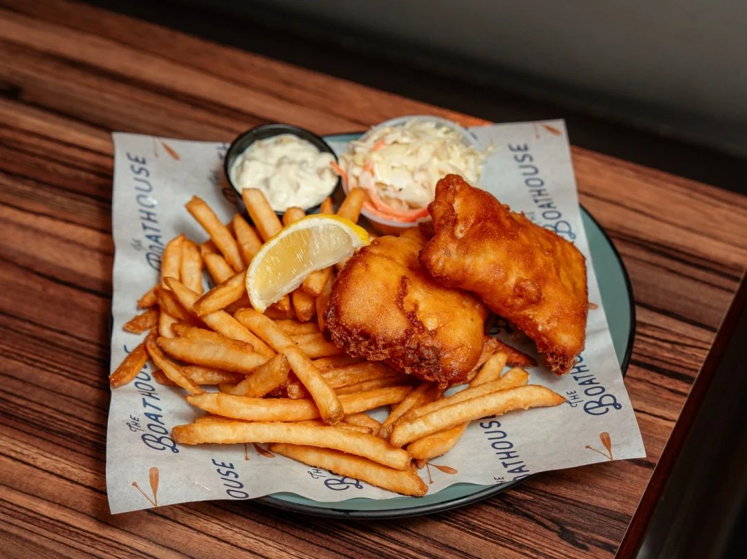 Nothing better than Fish &amp; Chips with a beautiful riverside view 🐟⚓️
Served with french fries, coleslaw, and tartar sauce! Come bask in the sun and enjoy a classic!🐟☀️
#boathouse #fishandchips