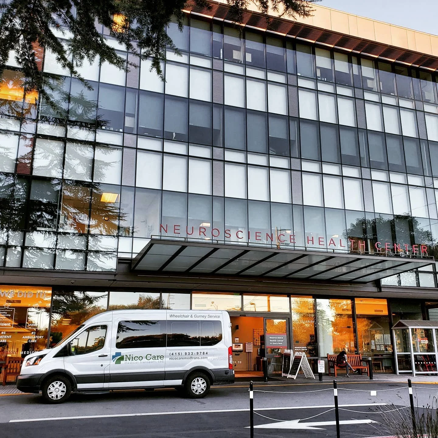 A nice looking building next to a beautiful non-emergency medical transport van. #nemt #wheelchair #wheelchairtransportation #medicaltransport #gurneytransport #stanfordhospital