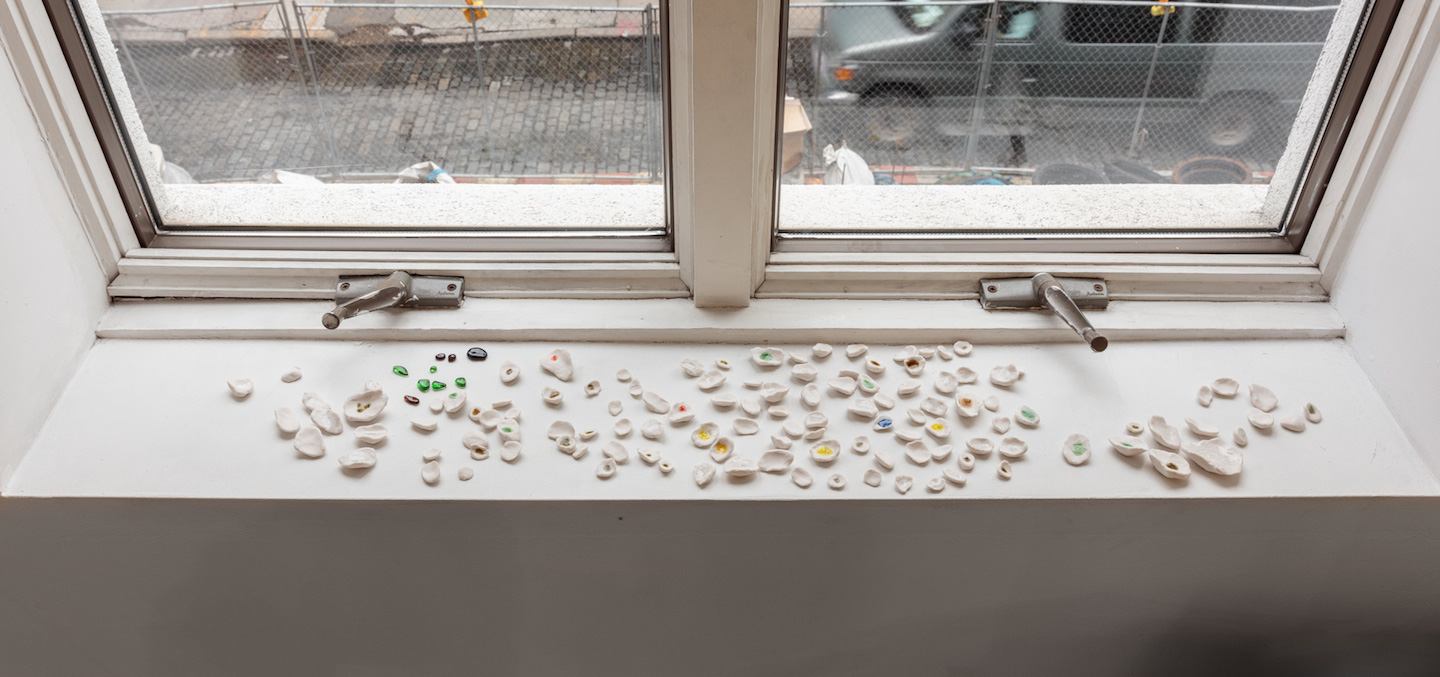  Kate Newby,  What’s the worst that can happen 1,  2018, Porcelain, found glass from sidewalks, Dimensions variable 