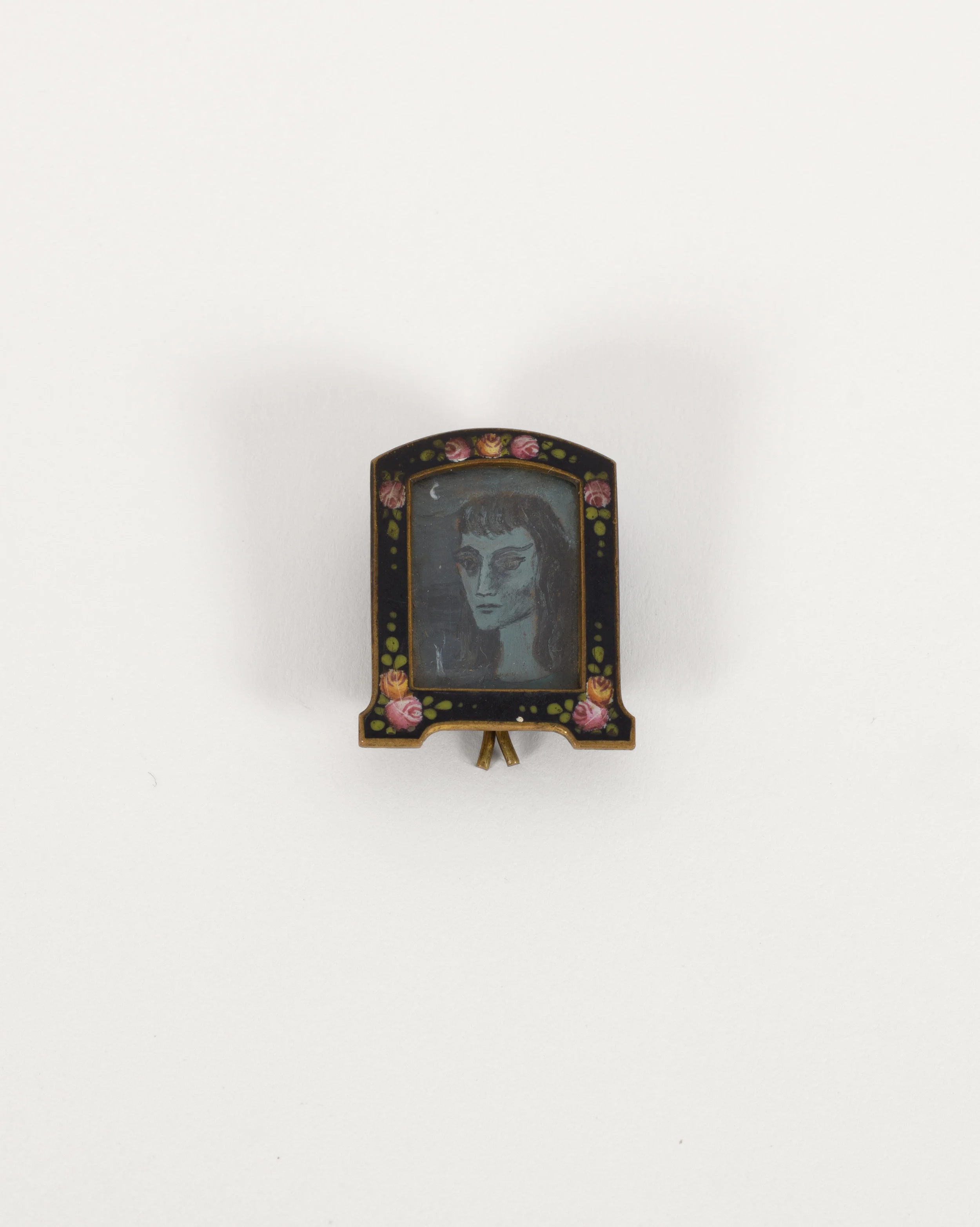 Miniature Self Portrait, n.d., Oil on masonite in frame, 7/8 × 1 inch (unframed); 1 3/8 × 1 1/16 inches (framed). Collection of August Becker.