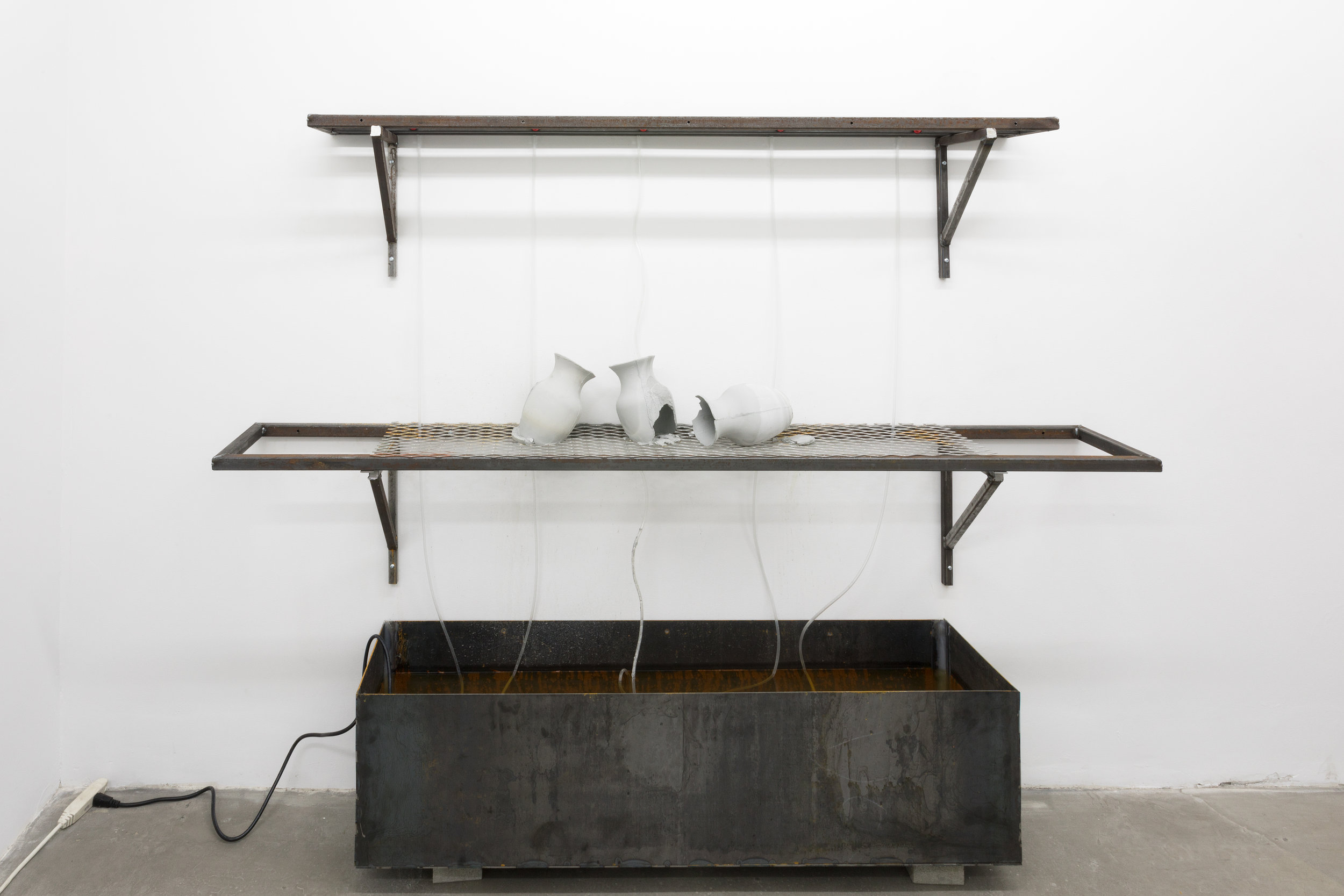  Azza El Siddique,  let me hear you sweat , 2018, Steel, unfired slip, water, slow drip irrigation system, Dimensions variable 