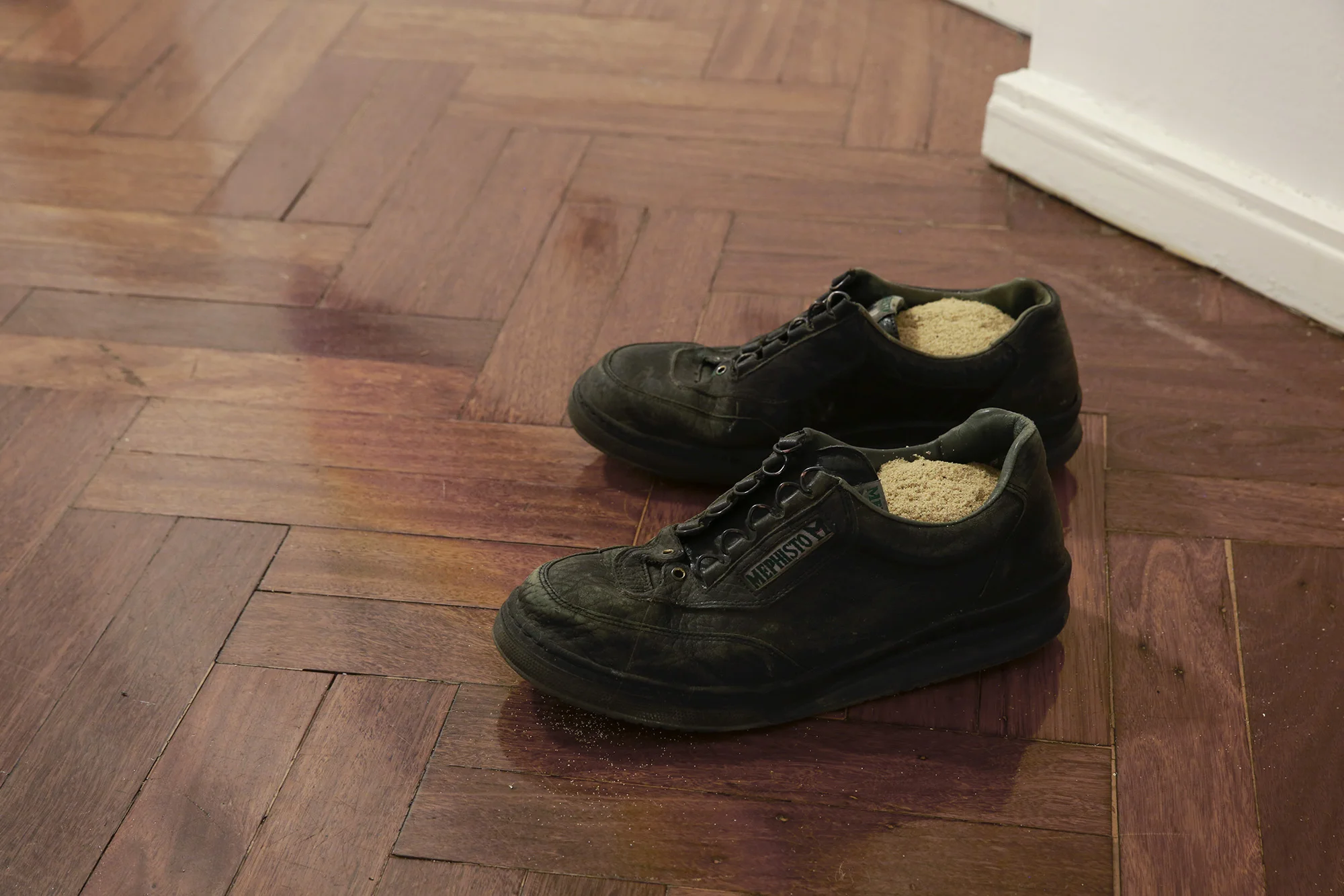 Keith J. Varadi, You Don't Know How It Feels , Artist's discarded shoes, Sydney beach sand, 2018