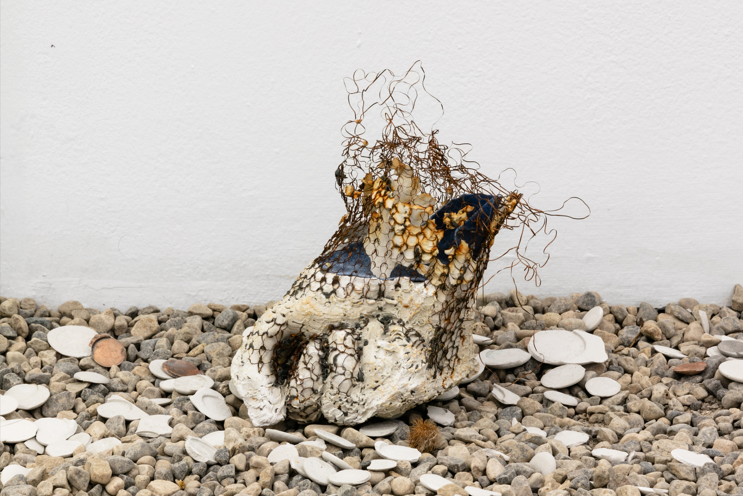  Jenine Marsh,  gap in fence (2) ,&nbsp;2019. Gypsum cement, wire, velveteen, pennies     