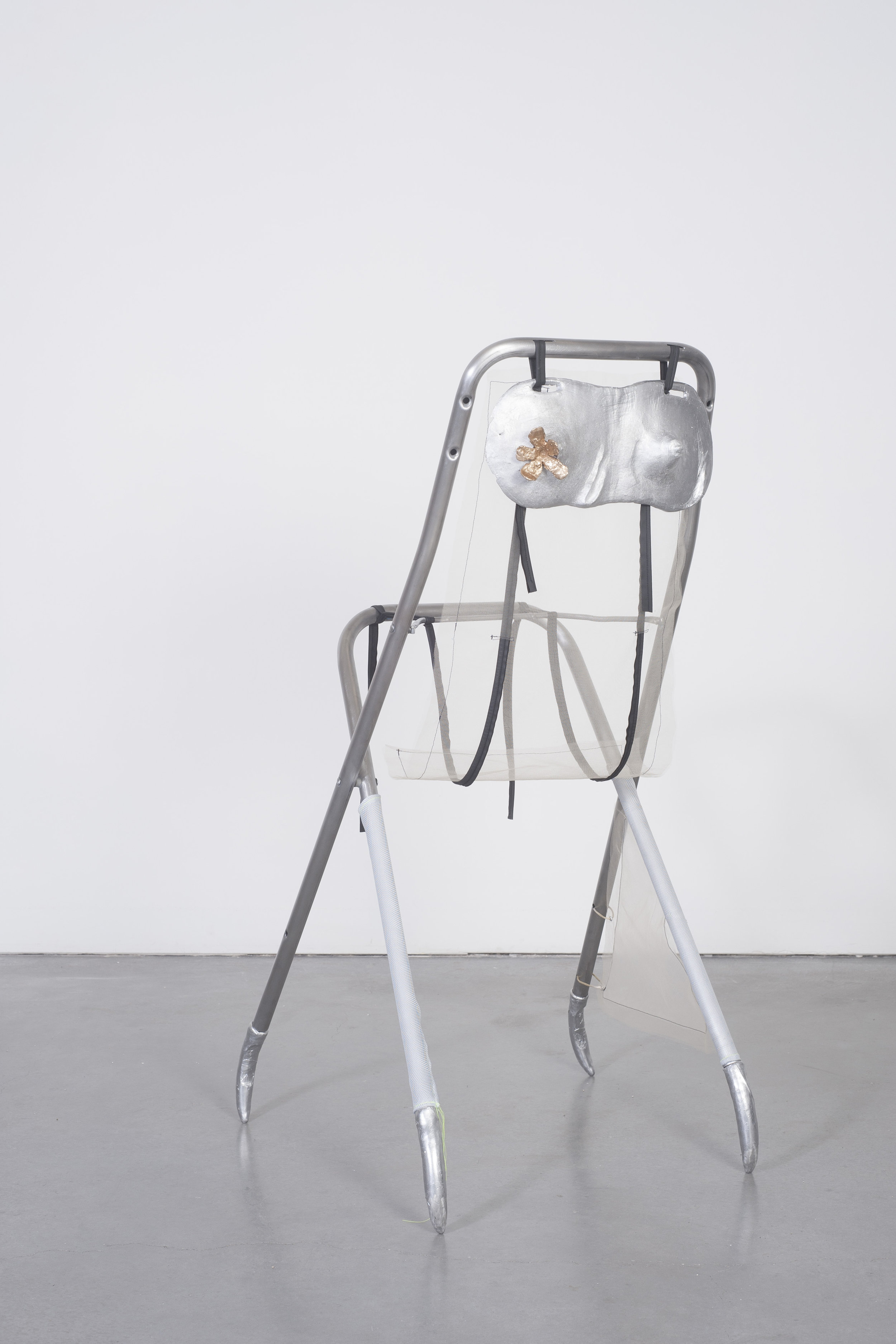  Ellie Hunter,  Trying it on , 2019, Cast aluminum, cast bronze, fabric, chair 