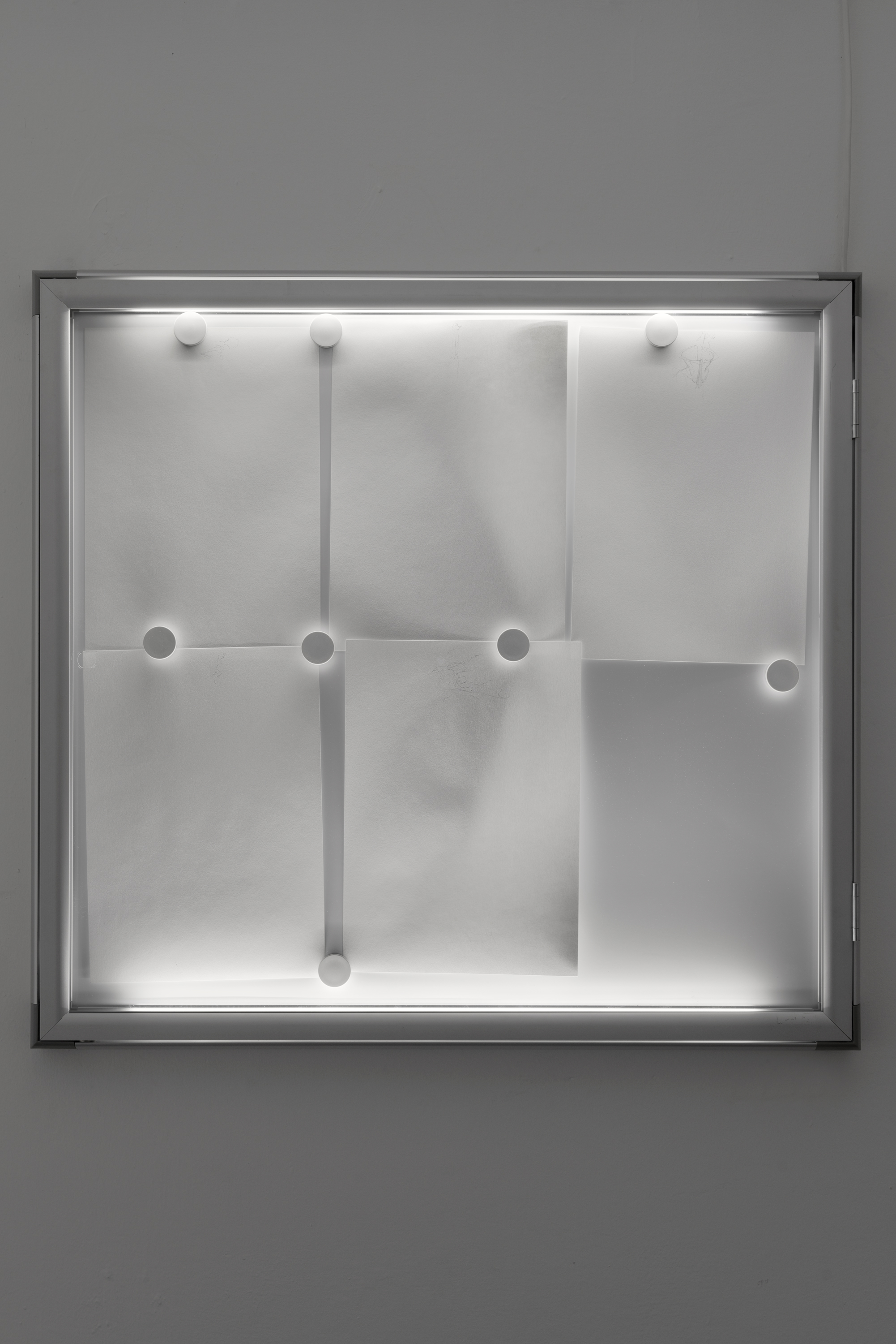  Philip Seibel,  Untitled , 2016-2019, pencil on A4 paper, magnets, display case, LED lights 