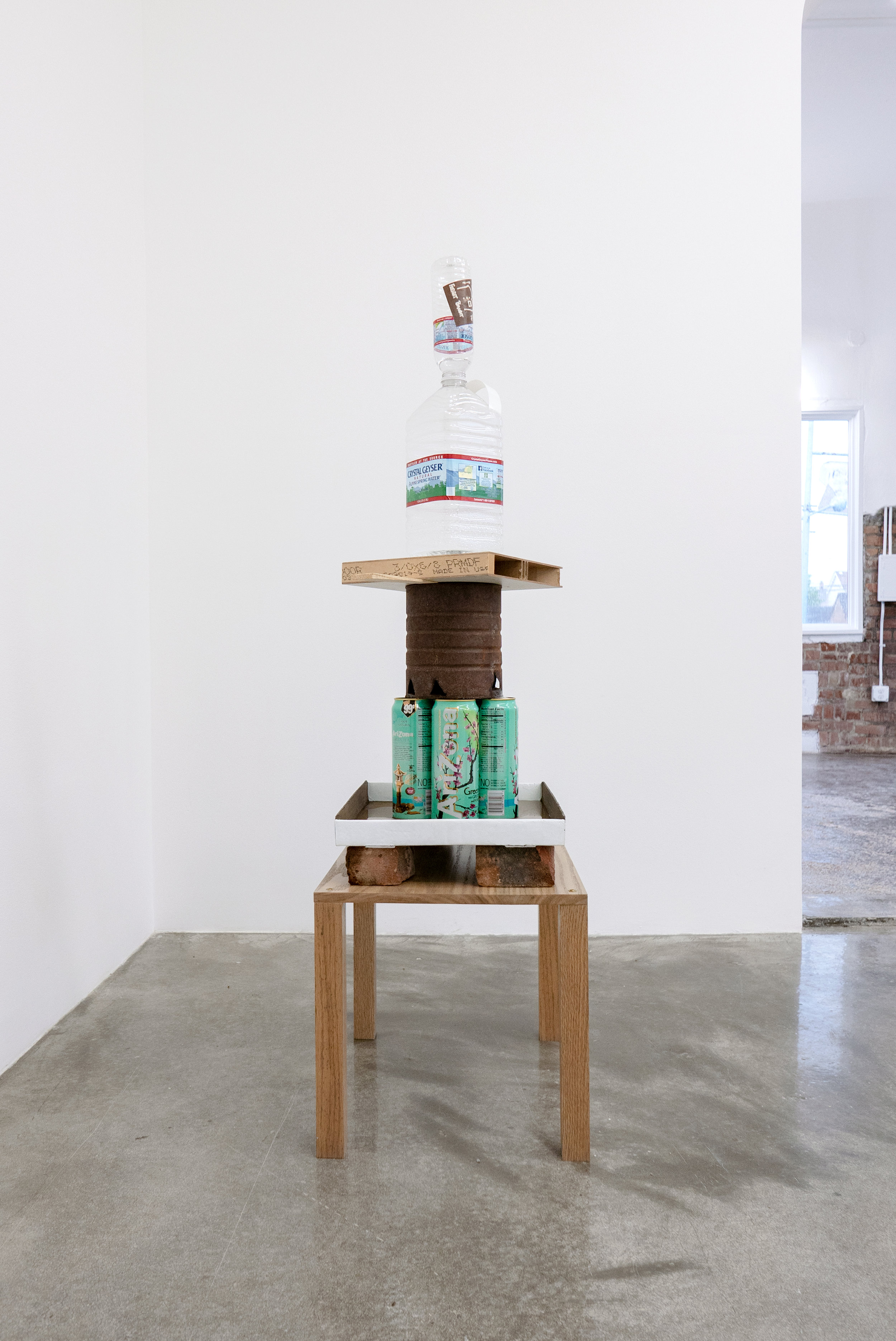  Matt Siegel,  Fountain #1 - CG Roxane East , 2019, Crystal Geyser water (source: Olancha, CA), stickers, quilting pins (sourced: Woodside Quilting, Des Moines, IA), Blue Sky DEF boxes (sourced: Palosade, CO), Crystal Geyser bottle (source: Johnston,
