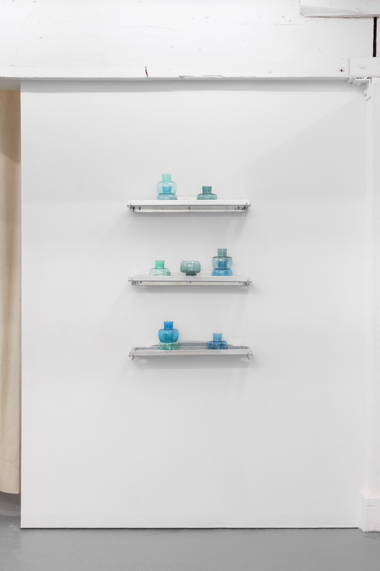  Khalil Jamal,  Neo-float shelf , 2016, Wheel polished aluminum, 24 x 6 x 1 in (60 x 15 x 2.5 cm)  &amp;  Khalil Jamal,  Buoy tea-light holders , 2016 Mouth blown glass, 4 x 5 in (10 x 13 cm) 