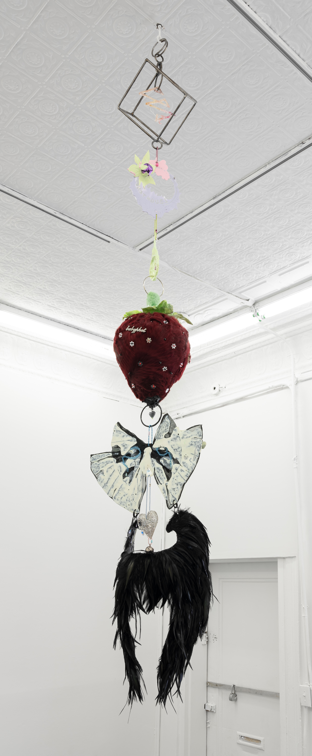  Izabelle New,  Keep Coming Back (patience),  2019 Steel Rod, Fine Silver, Resin, Assorted Hardware, Clover Flowers, Corn Husk Silks,Collected Charms, Rabbit Fur, Cock Feathers, Swarovski Crystals. A special thank you to Otis Denner-Kenny 