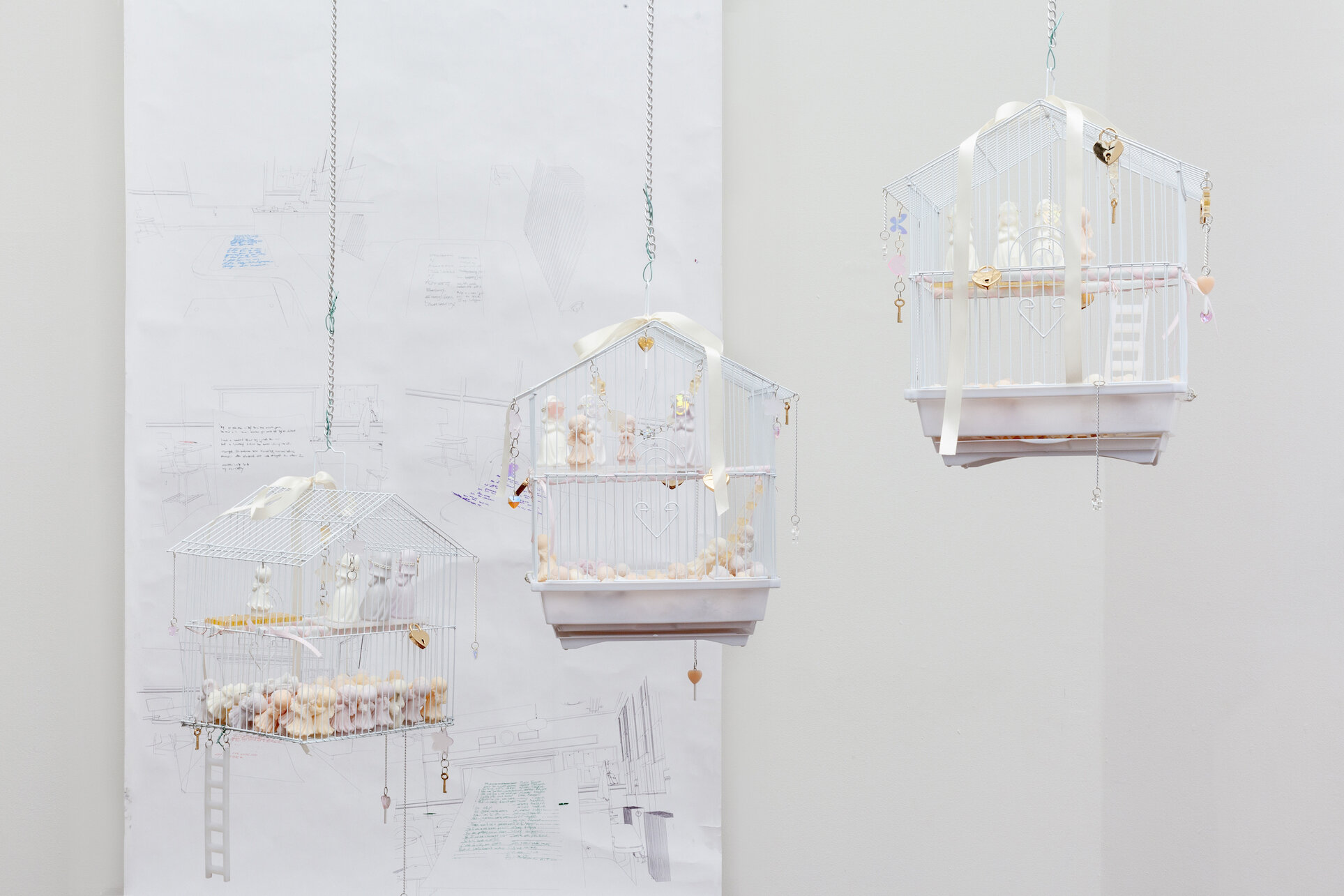  Emma Pryde,  Three White Suburban Homes , 2020, Wax, Acrylic Sheet, Metal Hardware, Ribbon, Resin, Swarovski Crystals, Birdcages, Left: 20 x 13 x 9.5 in (50.8 x 33 x 24 cm), Center: 19 x 12.5 x 9.5 in (48.2 x 31.8 x 24 cm), Right: 19 x 12.5 x 9.5 in