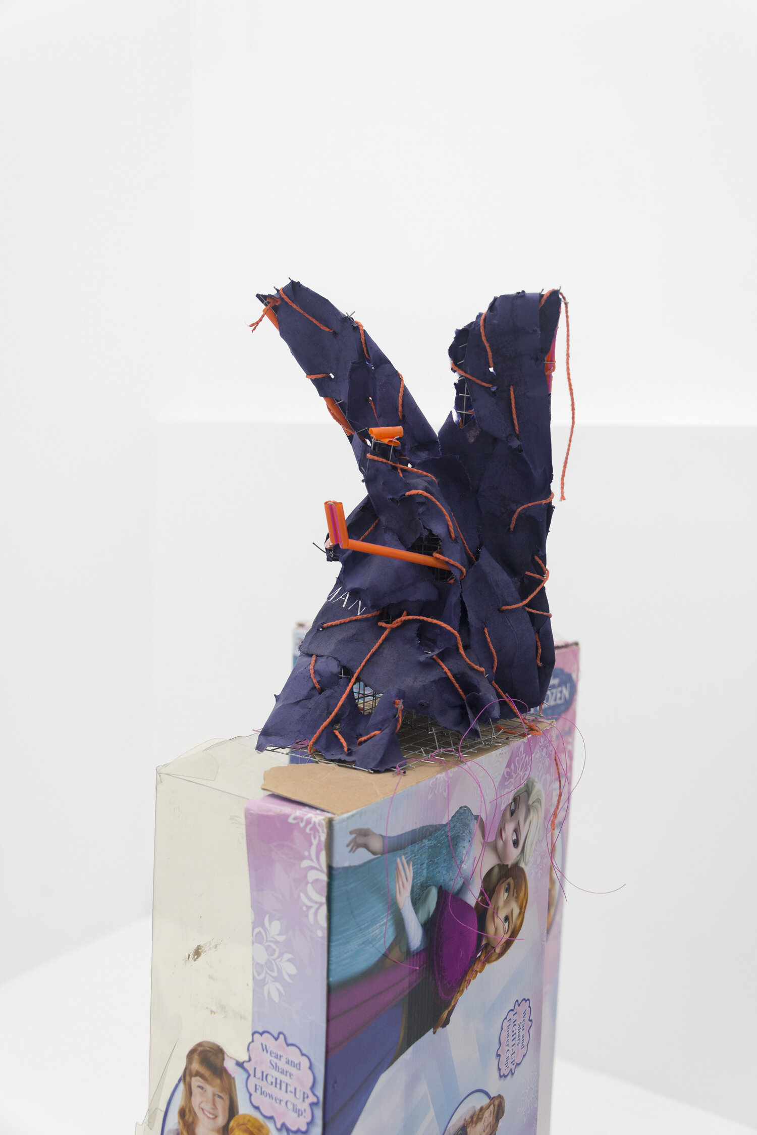   Angel 2b , 2019, Steel, paper, plastic straws, cotton twine. Pedestal: cardboard, plastic, waxed cotton thread 51x9x11in(figure only 12x9x9 in)  