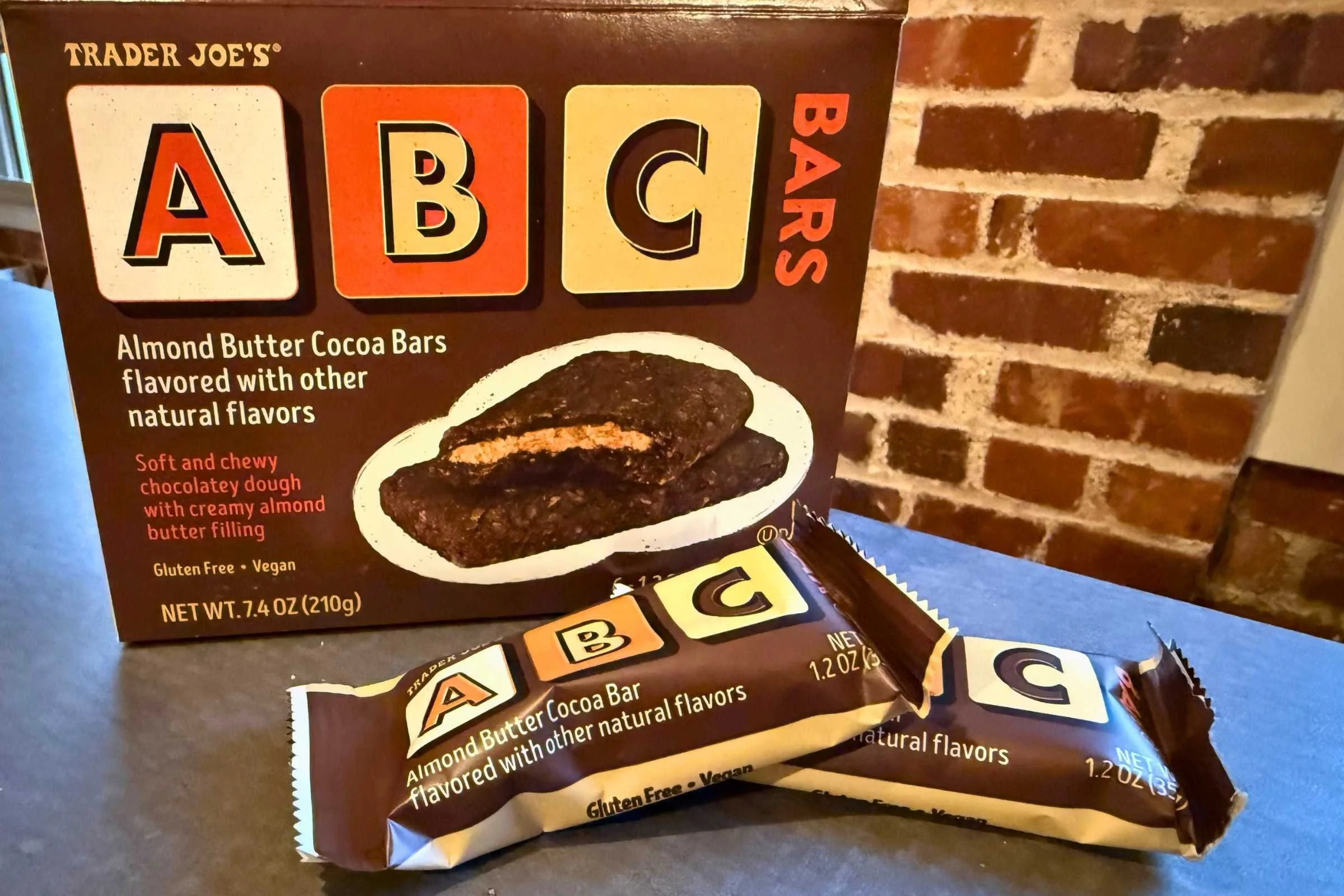 a box of Trader Joe’s ABC bars on a countertop with two bars resting next to it