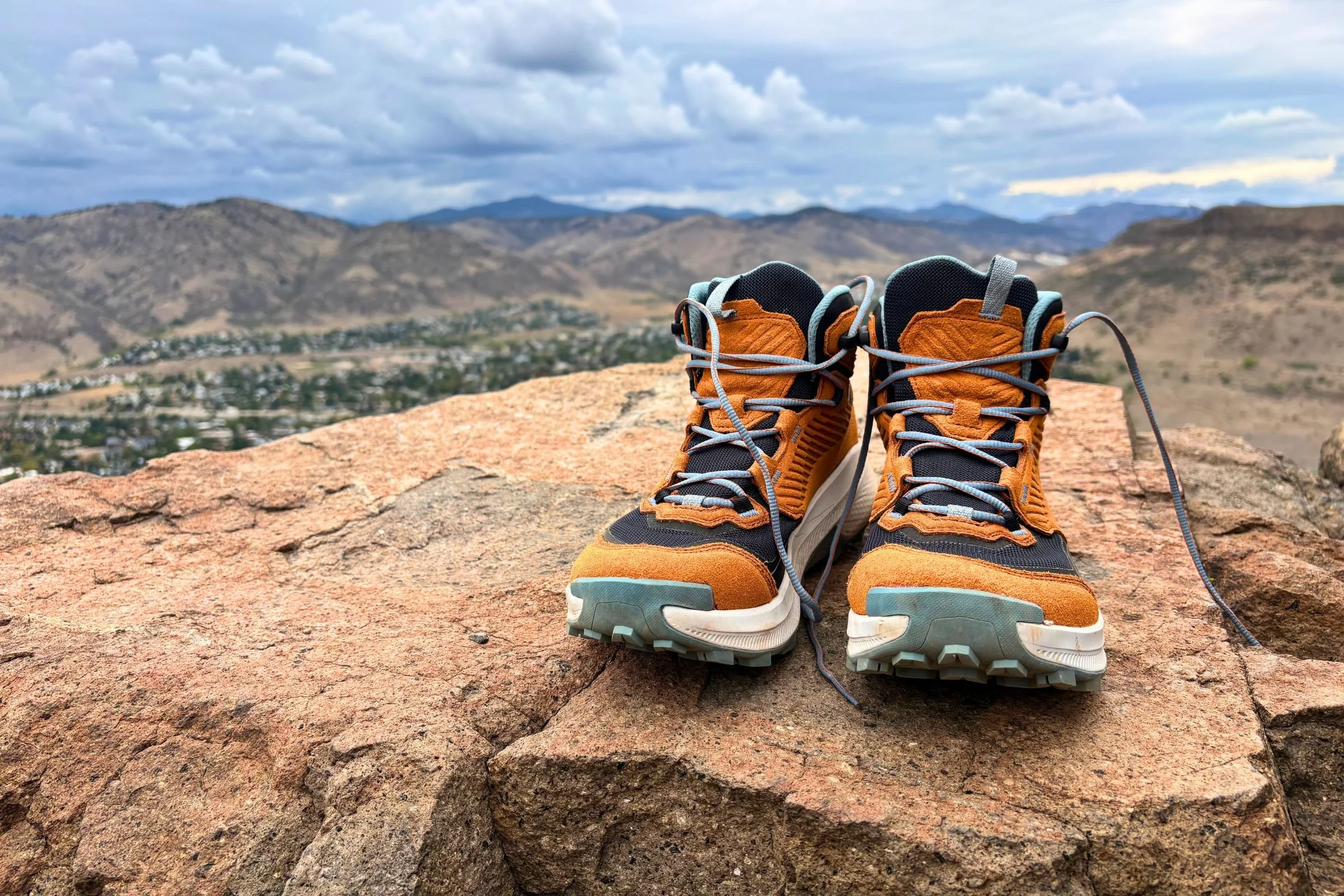 A pair of orange La Sportiva Prodigio Hike LT GTX hiking boots on a rock.
