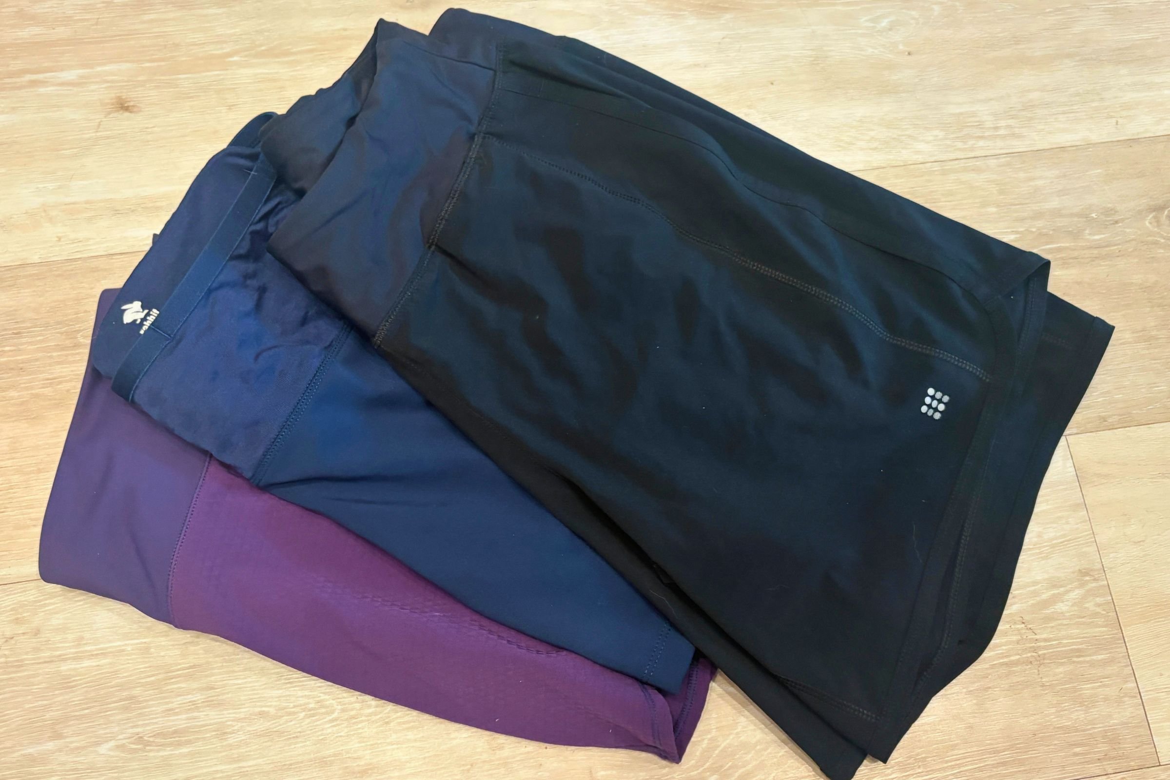 The Title Nine Anti-Run shorts have a longer inseam at 7” than many other running shorts. Here, they are compared to the Run Rabbit Leggy Smashems (blue) and the Oiselle Obsession Running Shorts (purple).