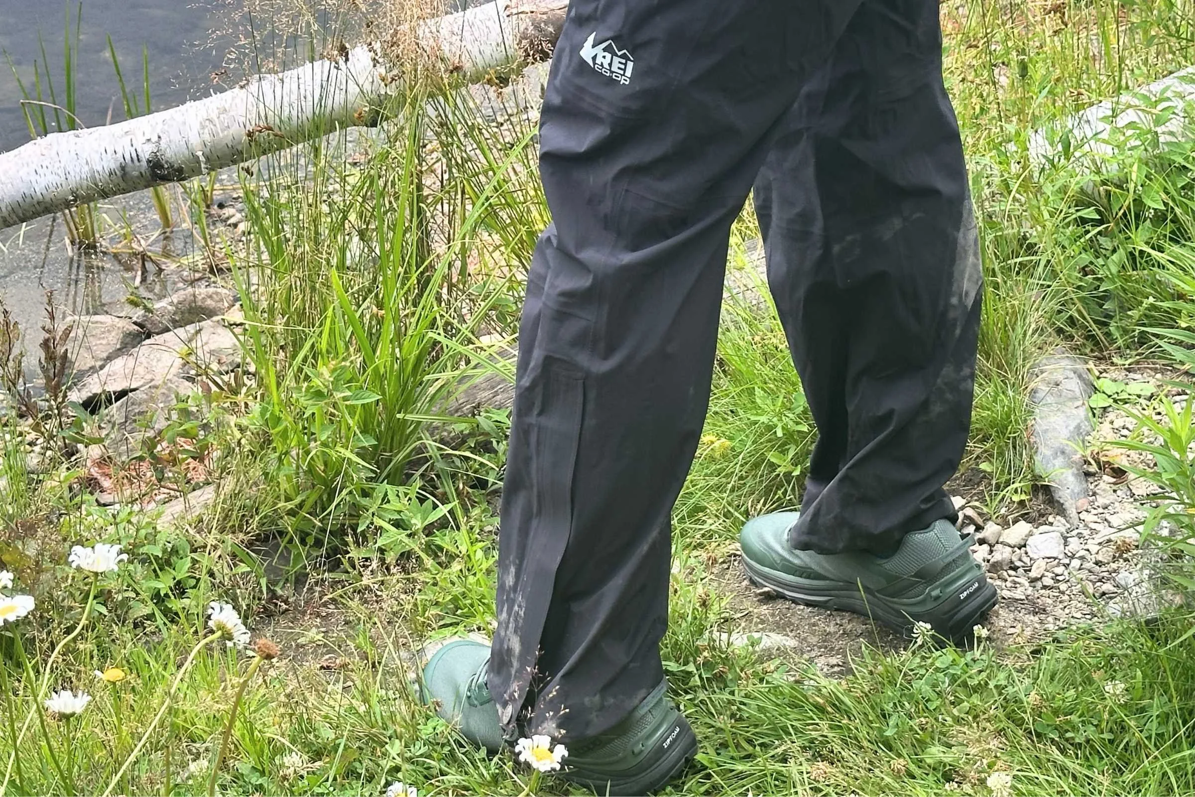 Side view of the REI Co-op XeroCloud rain pants shows the articulated knee panels.
