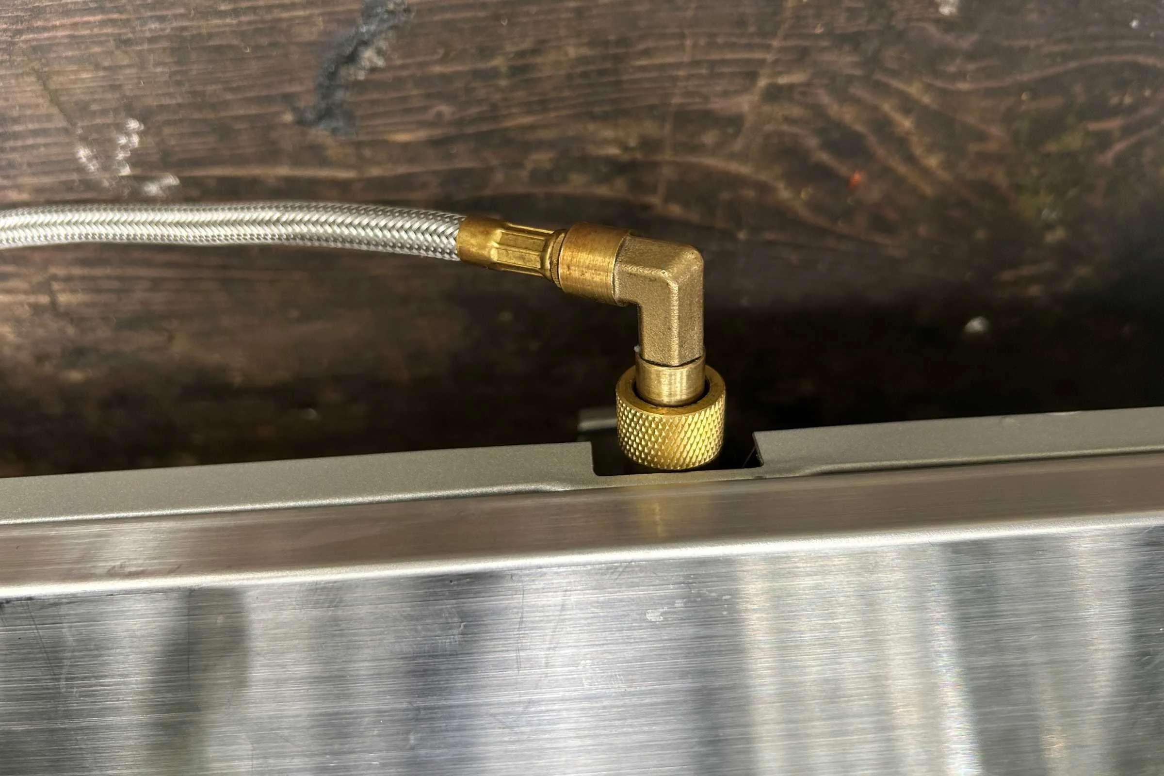 Close up on the flexible propane hose on the GSI Pinnacle Pro stove.