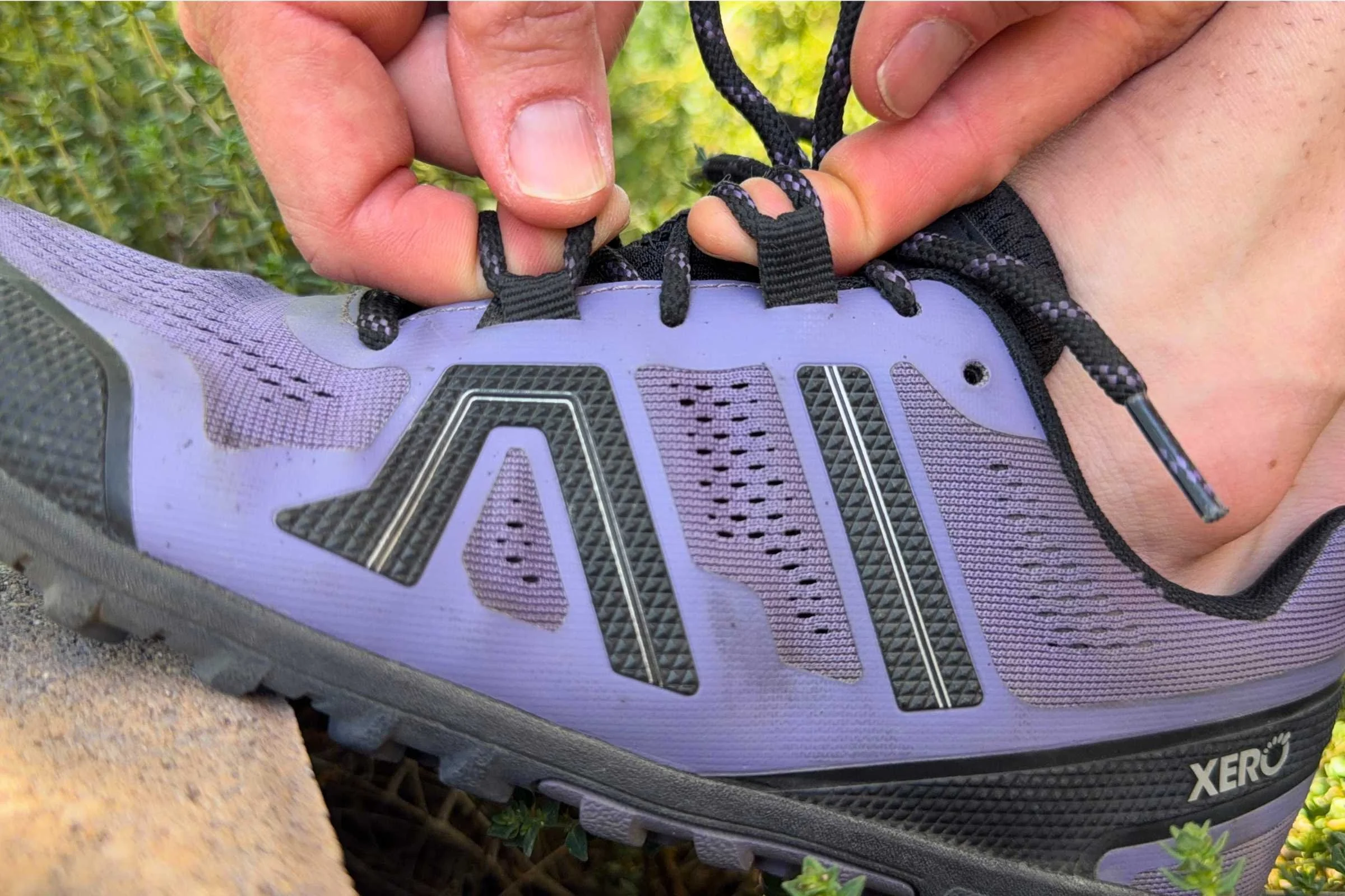 Showing where the two hidden straps are on the Xero Mesa Trail II, connecting the midfoot, instep, and heel adjustments to the lacing system. Photo courtesy Maggie Nichols