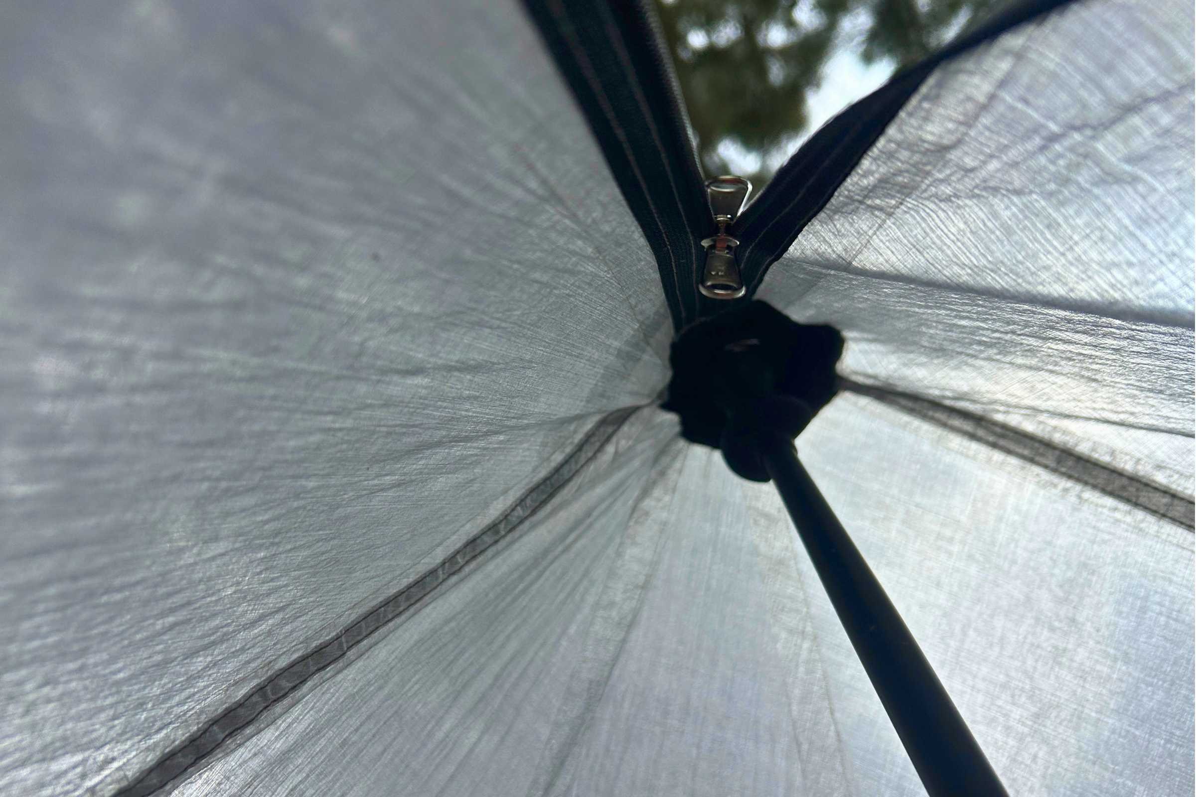 The inside of an ultralight shelter set up with a Gossamer Gear FT3 trekking pole.