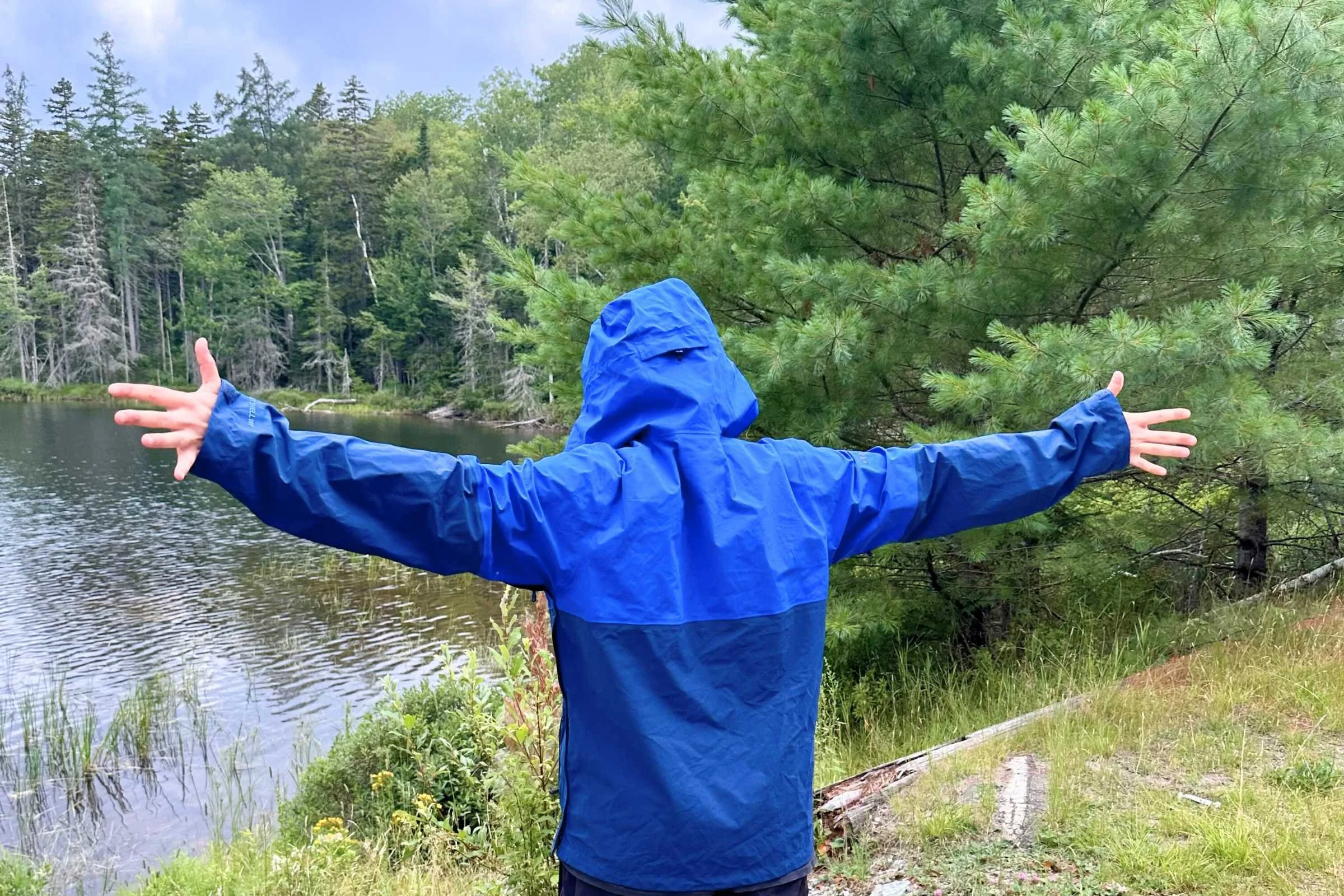 Elliot showing his wingspan in the Outdoor Research Foray jacket