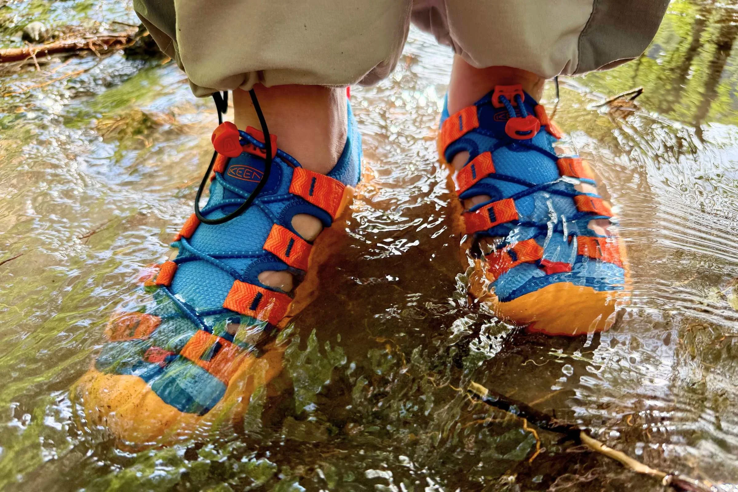 Standing in moving water wearing the Keen Hyperport H2 sandals