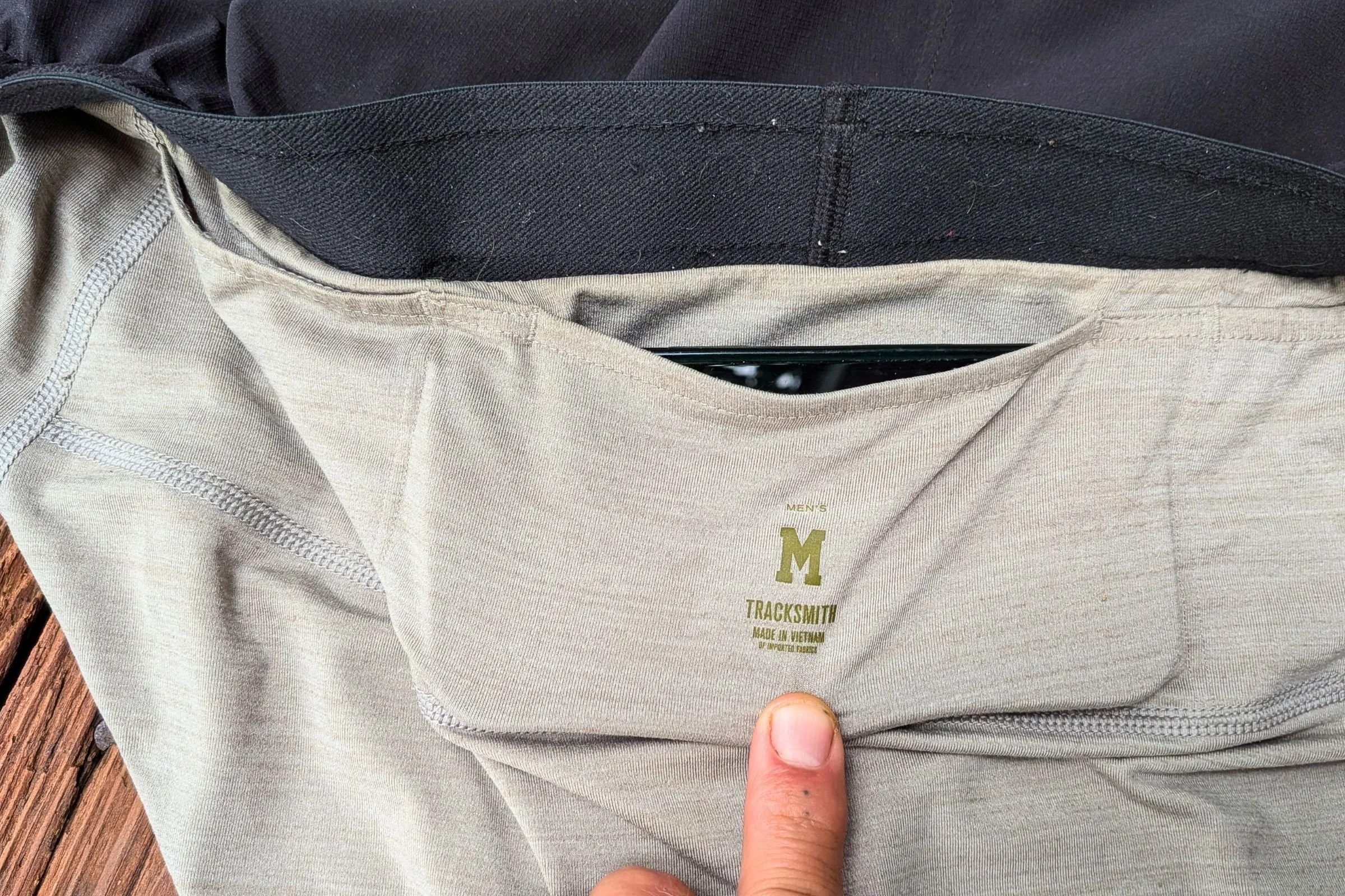 Close-up of the small middle pocket on Tracksmith Twilight Running Shorts.