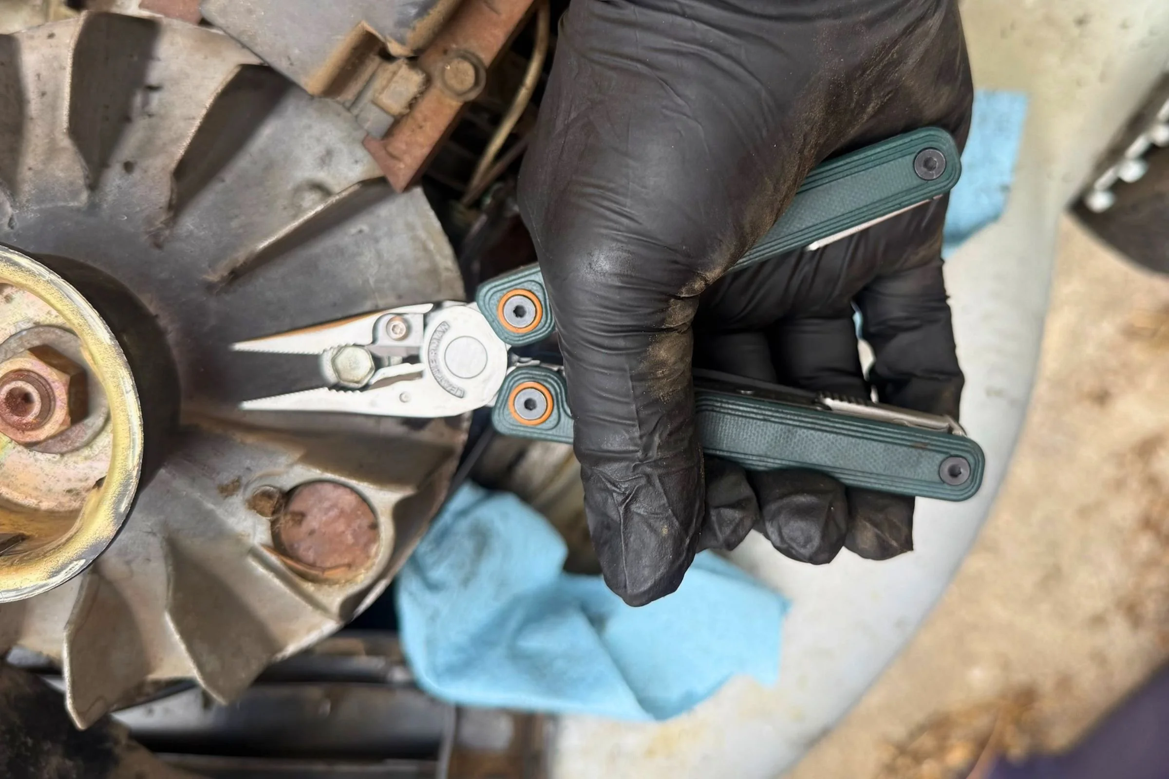 Pliers on the Leatherman Wave Alpha easily gripped bolts to repair an old lawnmower engine. Courtesy Chris Meehan