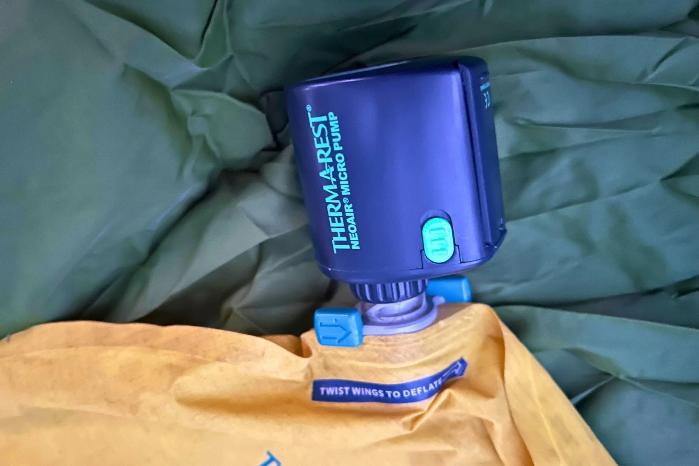 Therm-a-Rest NeoAir Micro Pump attached to a backpacking air mattress