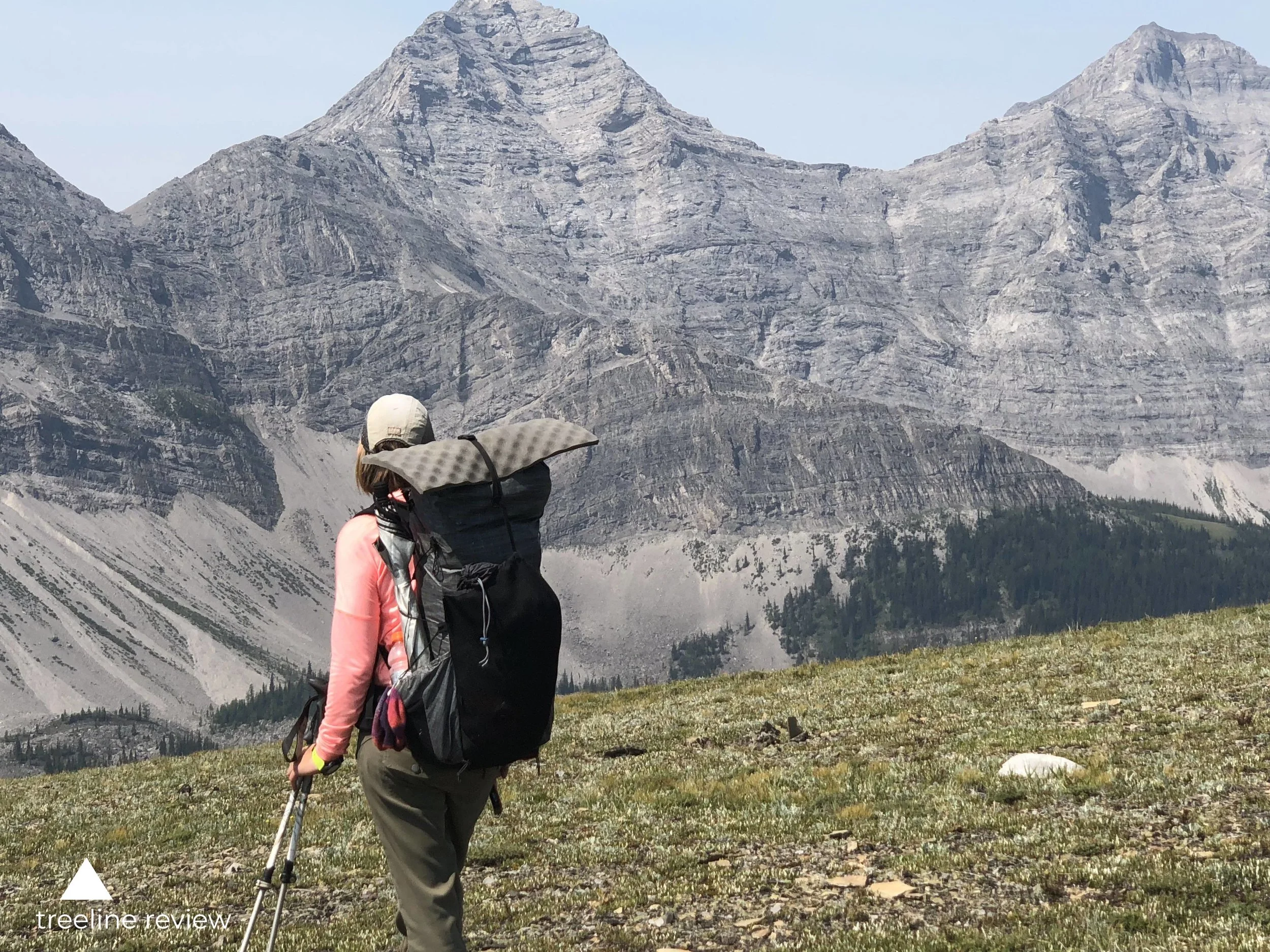 The Katabatic Liteskin in Jasper National Park on the Great Divide Trail. Note how the shock cord along the side secures the umbrella. The water bottle pocket on the right is holding a Smartwater Bottle with a Sawyer water filter on top. The strap on top holds down an foam sit pad. Photo by Mike Unger.