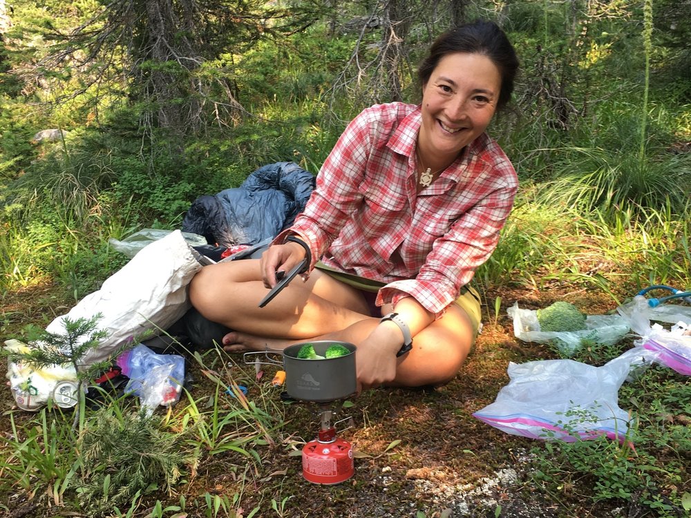 The author cooking up broccoli in one of the TOAKS pots that we tested on the Pacific Northwest Trail, a 1200 mile long backpacking trip from Montana to the Pacific Ocean. Photo courtesy Naomi Hudetz.