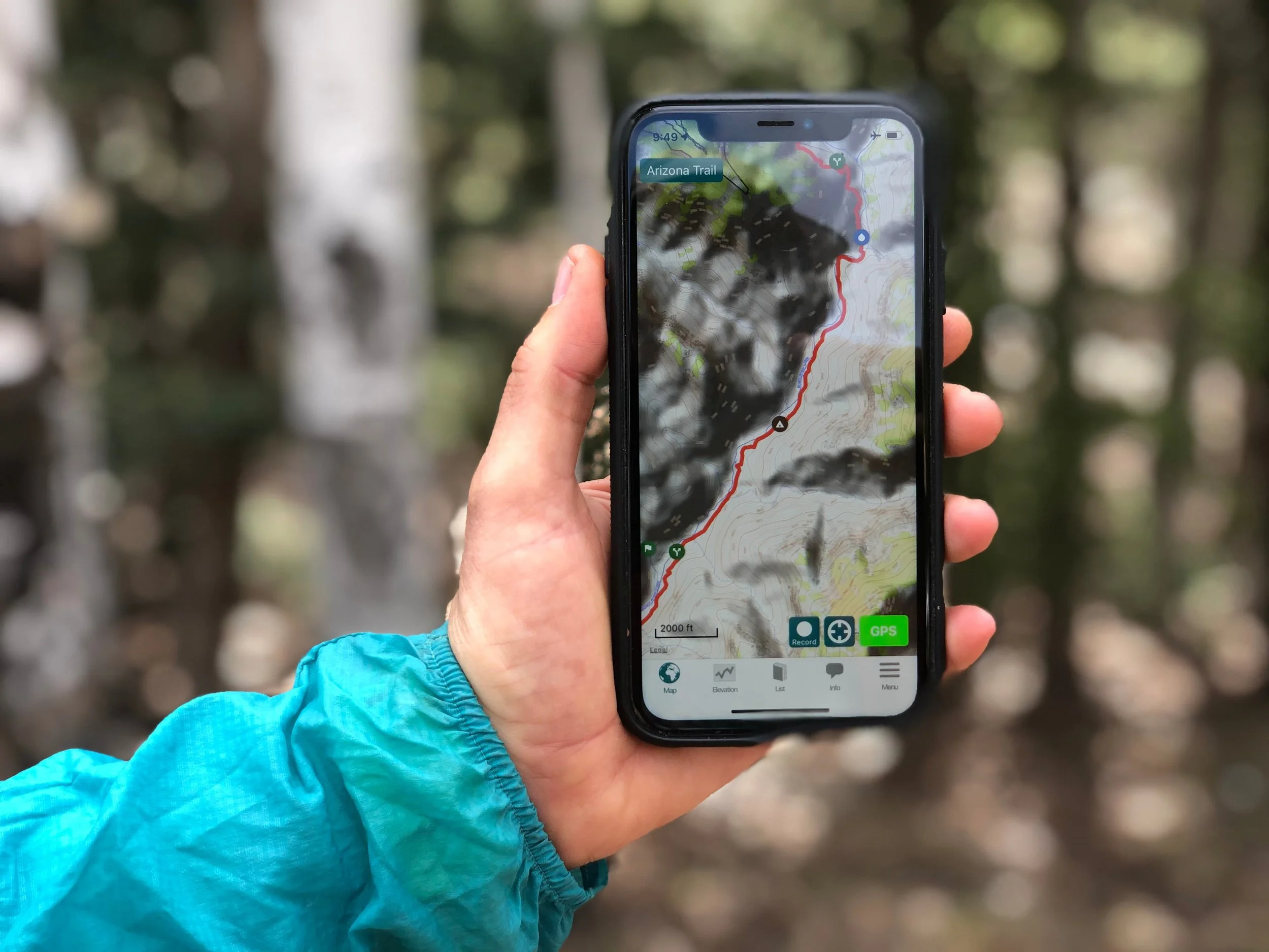 The iPhone has quickly become a useful gear item that most long distance hikers bring for taking photos, journaling, entertainment, and navigating on their adventures. Here it is shown with the Guthook AZT app. Photo courtesy Naomi Hudetz