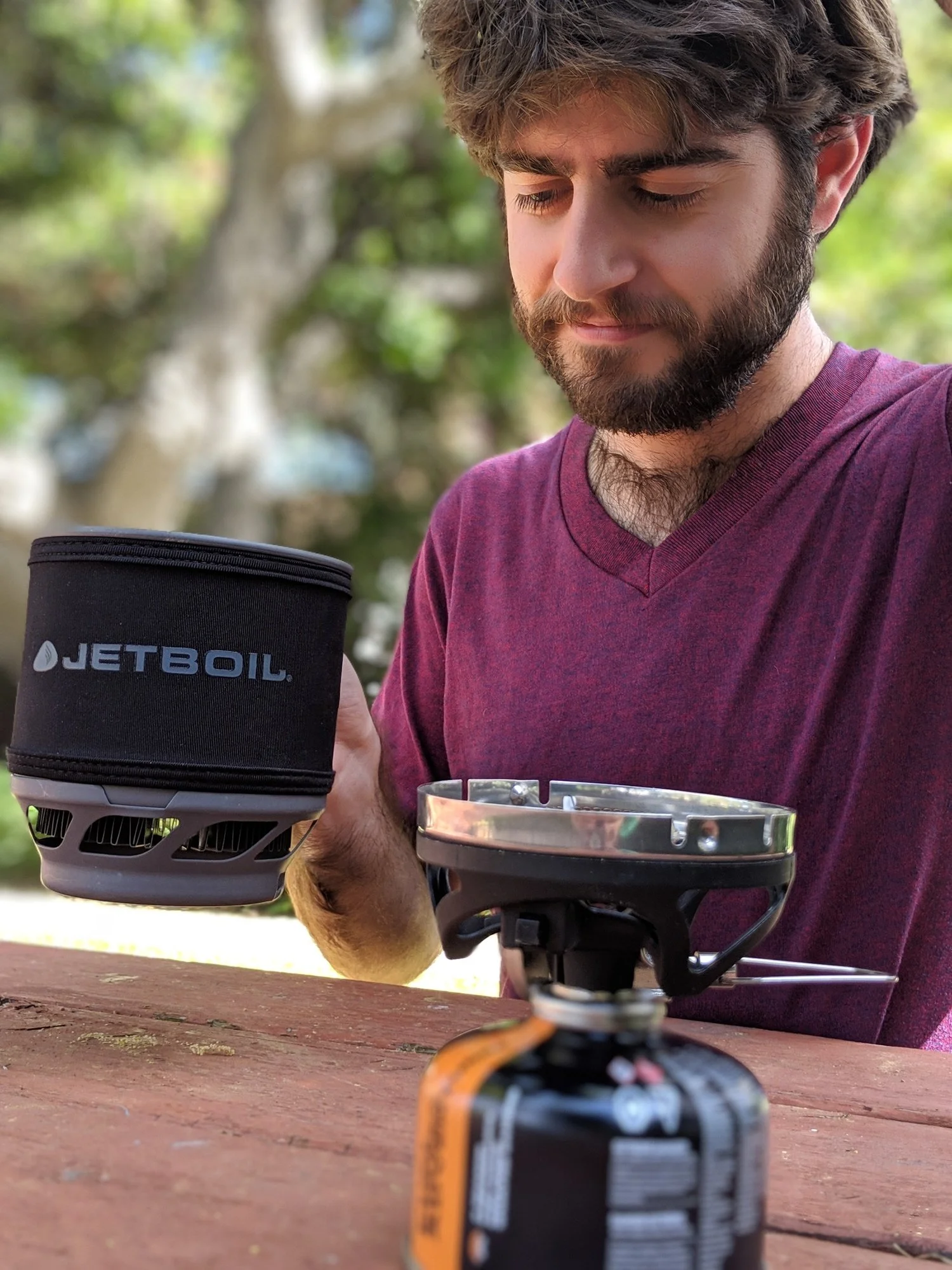 The Jetboil MiniMo comes with full handles and a squat pot that fits into backpacks better than most integrated stoves. Photo courtesy Liz Thomas.