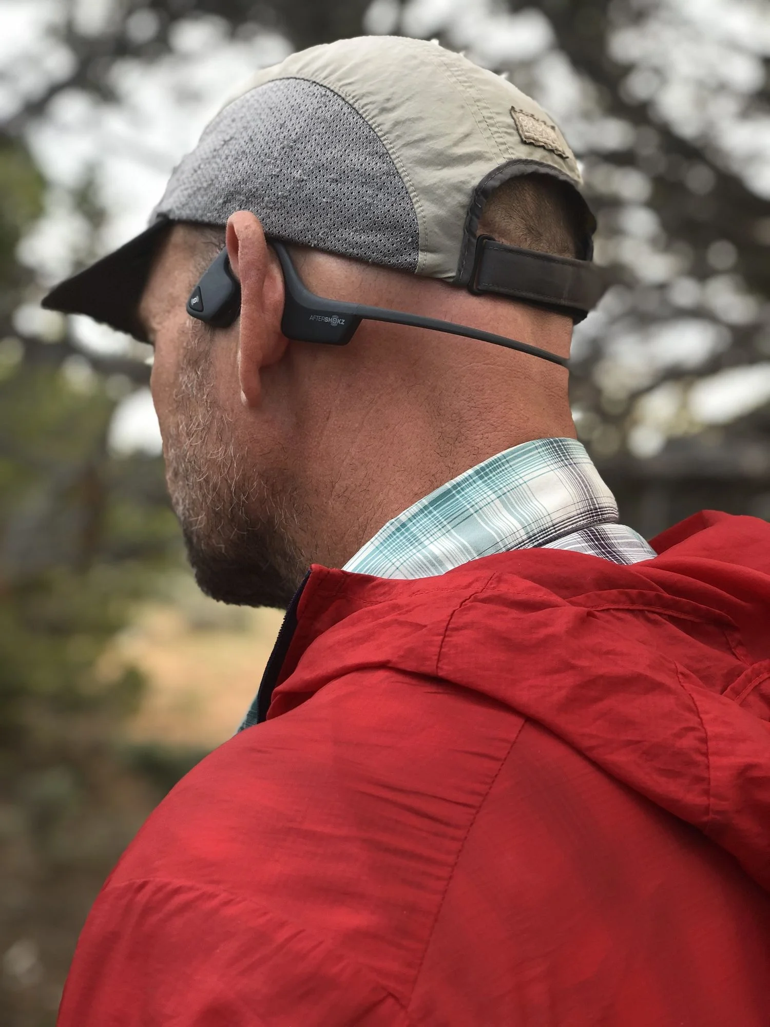The Aftershokz Trekz Air headphones are our pick for Situational Awareness. They work by not covering your eardrums, meaning you can still hear that rattlesnake, car approaching, or your hiking partner calling for help.