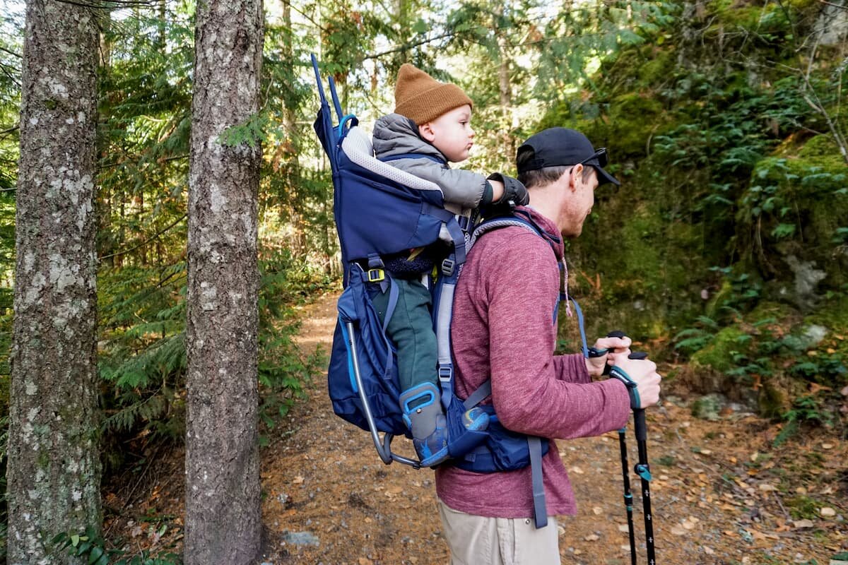 baby holding backpack