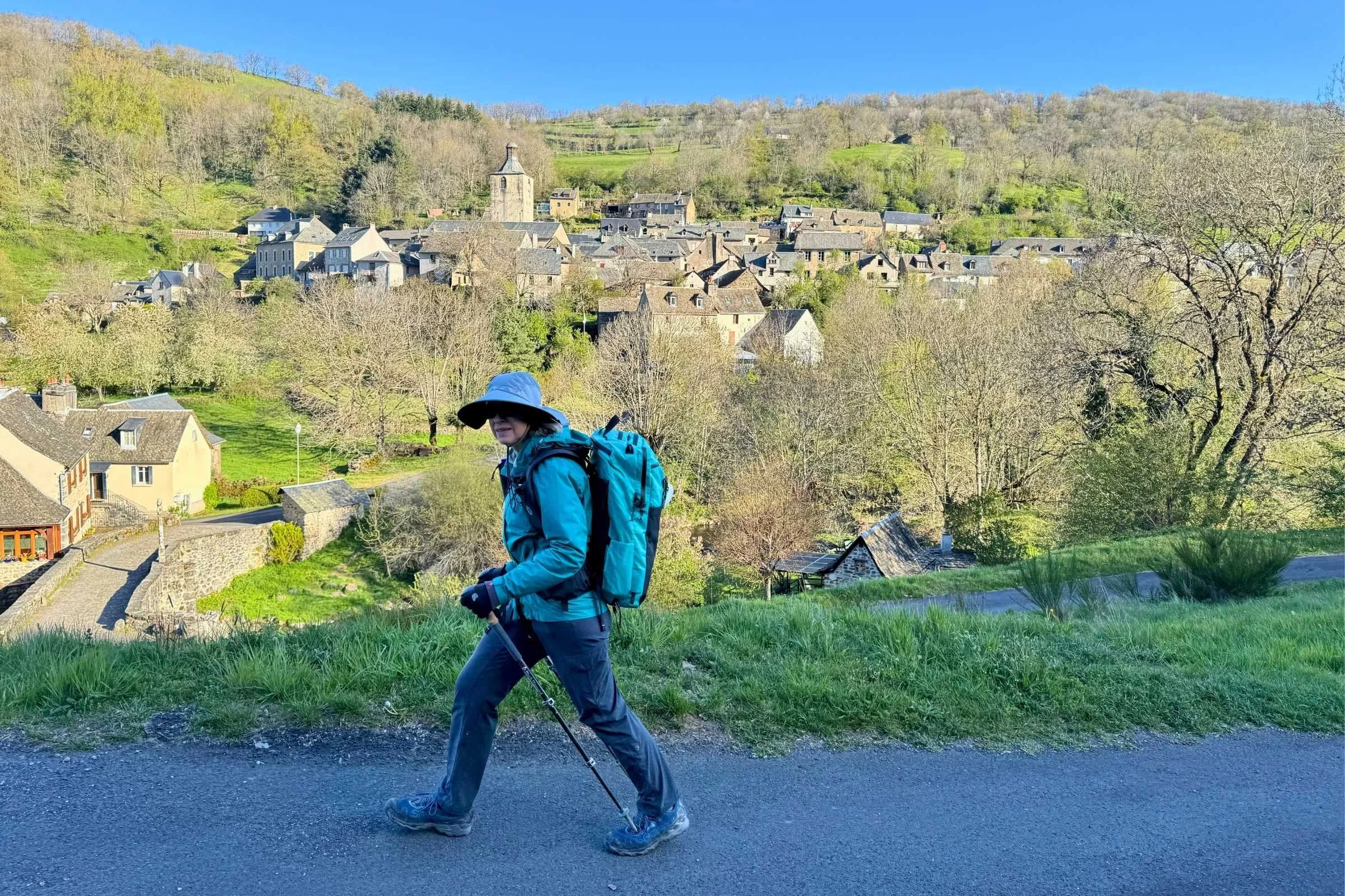 Pilgrim on the Camino de Santiago carrying the Six Moon Designs ADC Travel Backpack