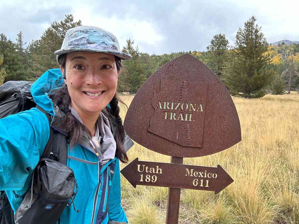 arizona-trail-hiker-with-metal-sign.jpg