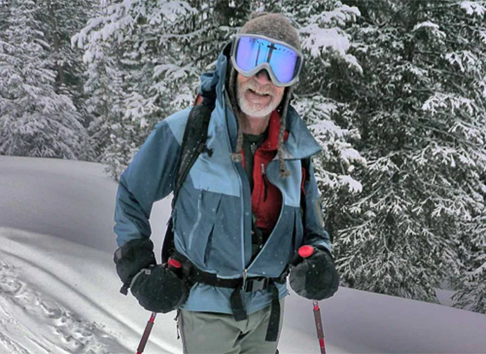   Yellowstone National Park backcountry ski guide Jesse Logan (Dr. J) photographed while taking a break from skinning up a steep slope before skiing down in the backcountry of Yellowstone.   Photo by Beau Fredlund, photo courtesy of Jesse Logan.  