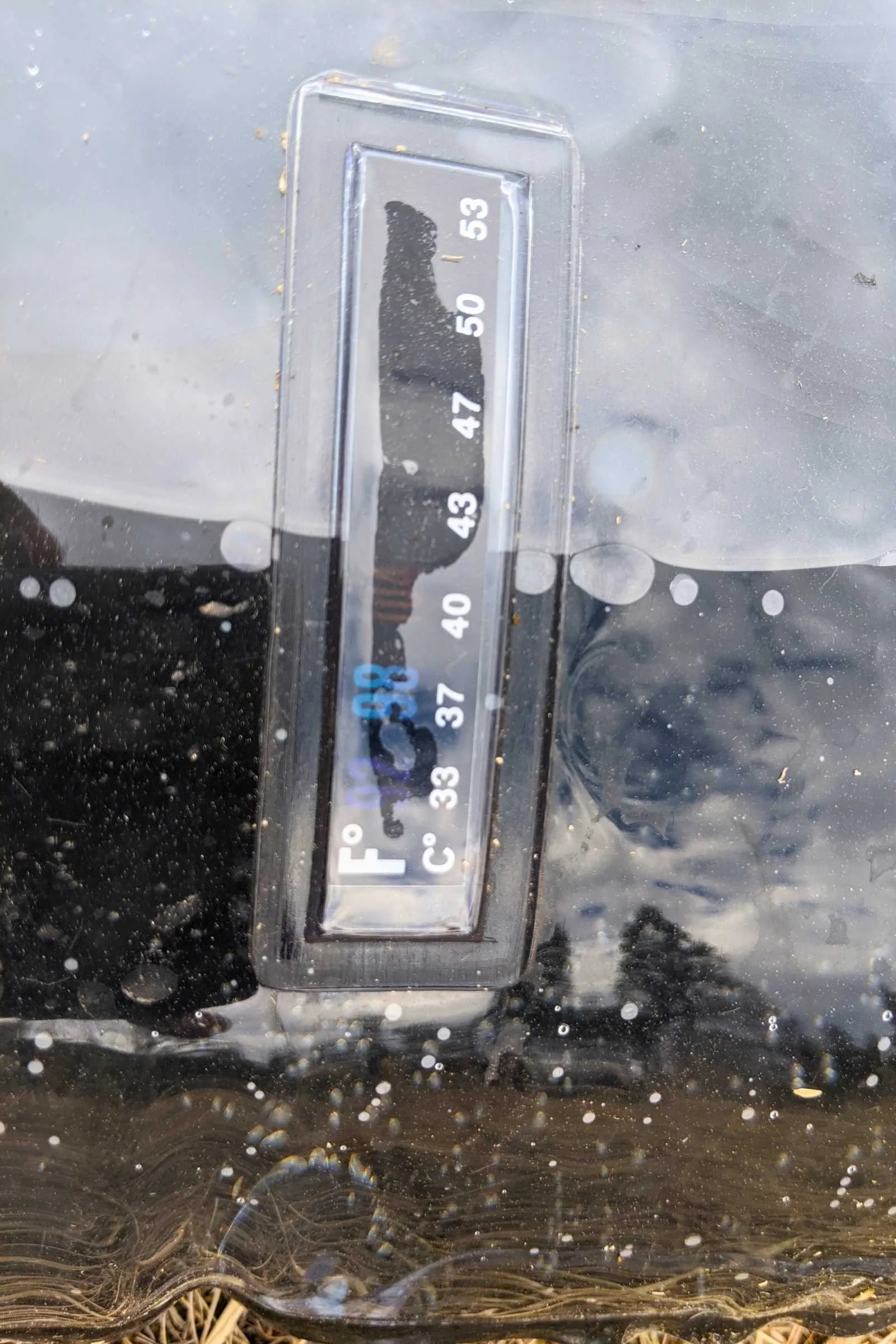 The built-in thermometer on the Advanced Elements summer shower set.
