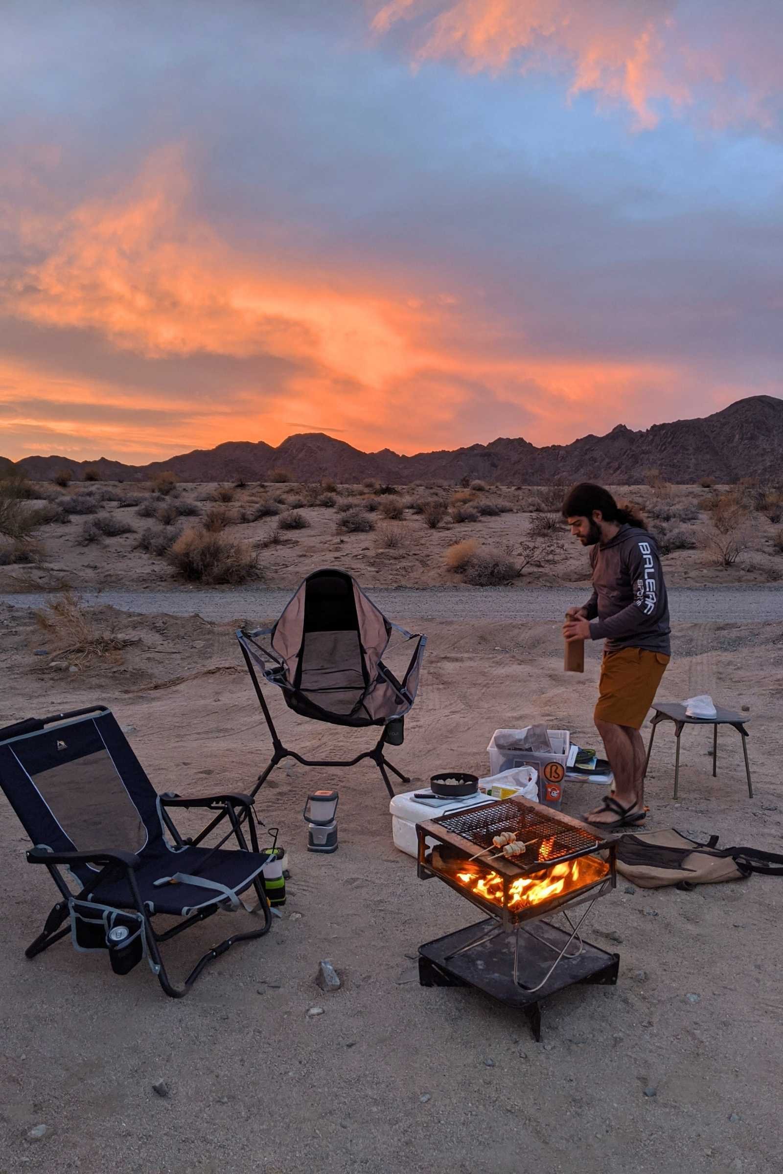 The height of the Takibi grill is perfect for sitting around the fire in camping chairs. Here, we’re grilling sausages on sticks outside of Joshua Tree National Park in a dispersed camping area with no established fire pit. The base catches all ash