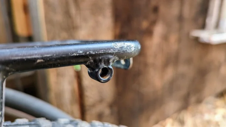 close up of threaded bosses on the side of the Tumbleweed Mini Pannier Rack.