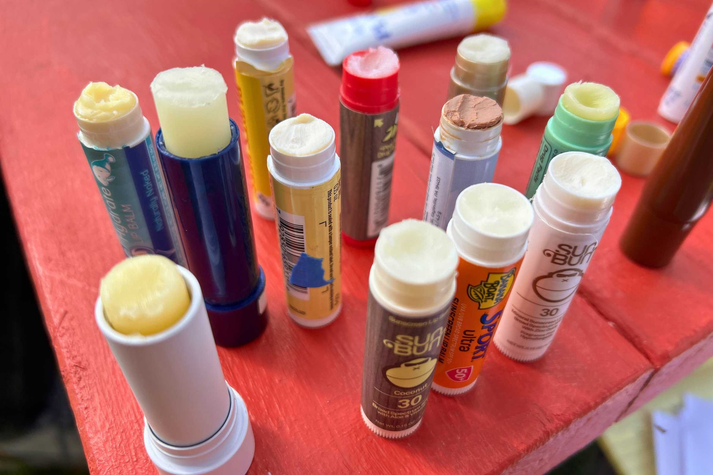 The Aquaphor (third from the left in dark blue packaging) is the tallest lip balm we tested. Unlike many lip balms we tested, it doesn't feel greasy and won't melt in a hot car.