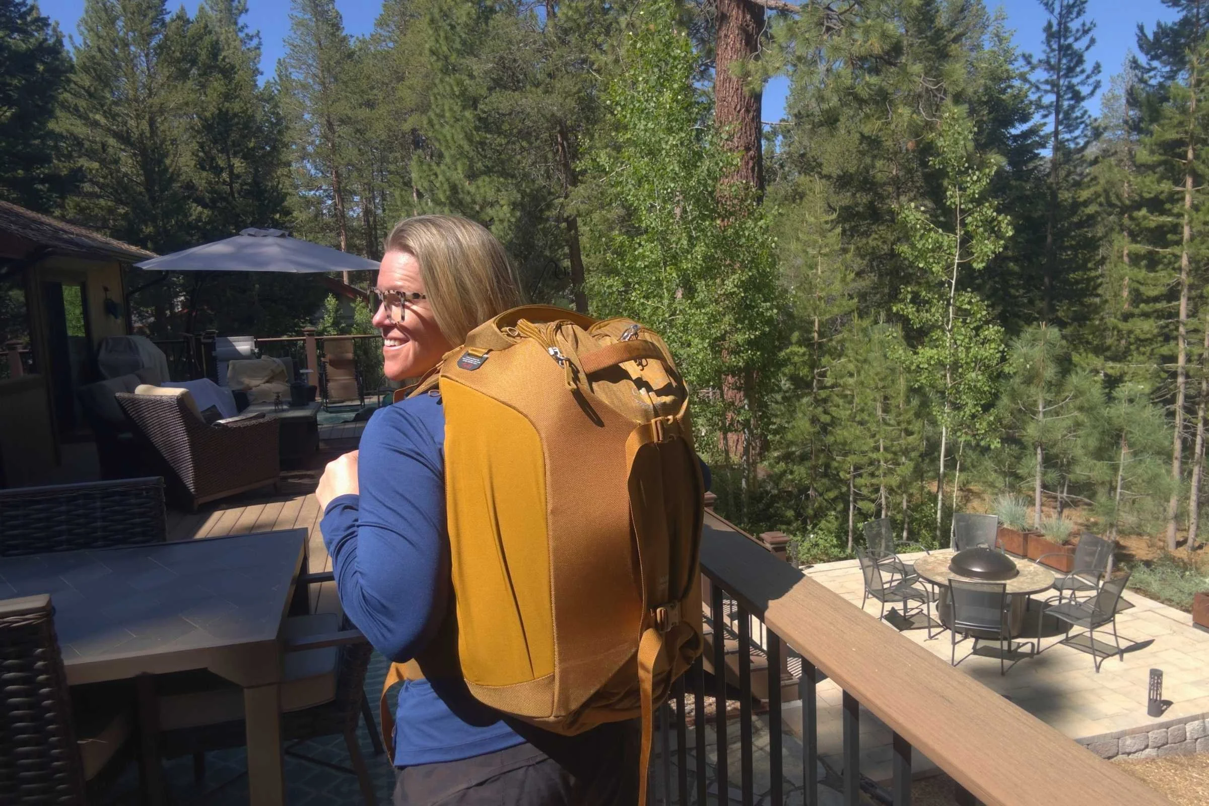 Traveler showing off the Osprey Sojourn Porter 46 they are wearing on their back