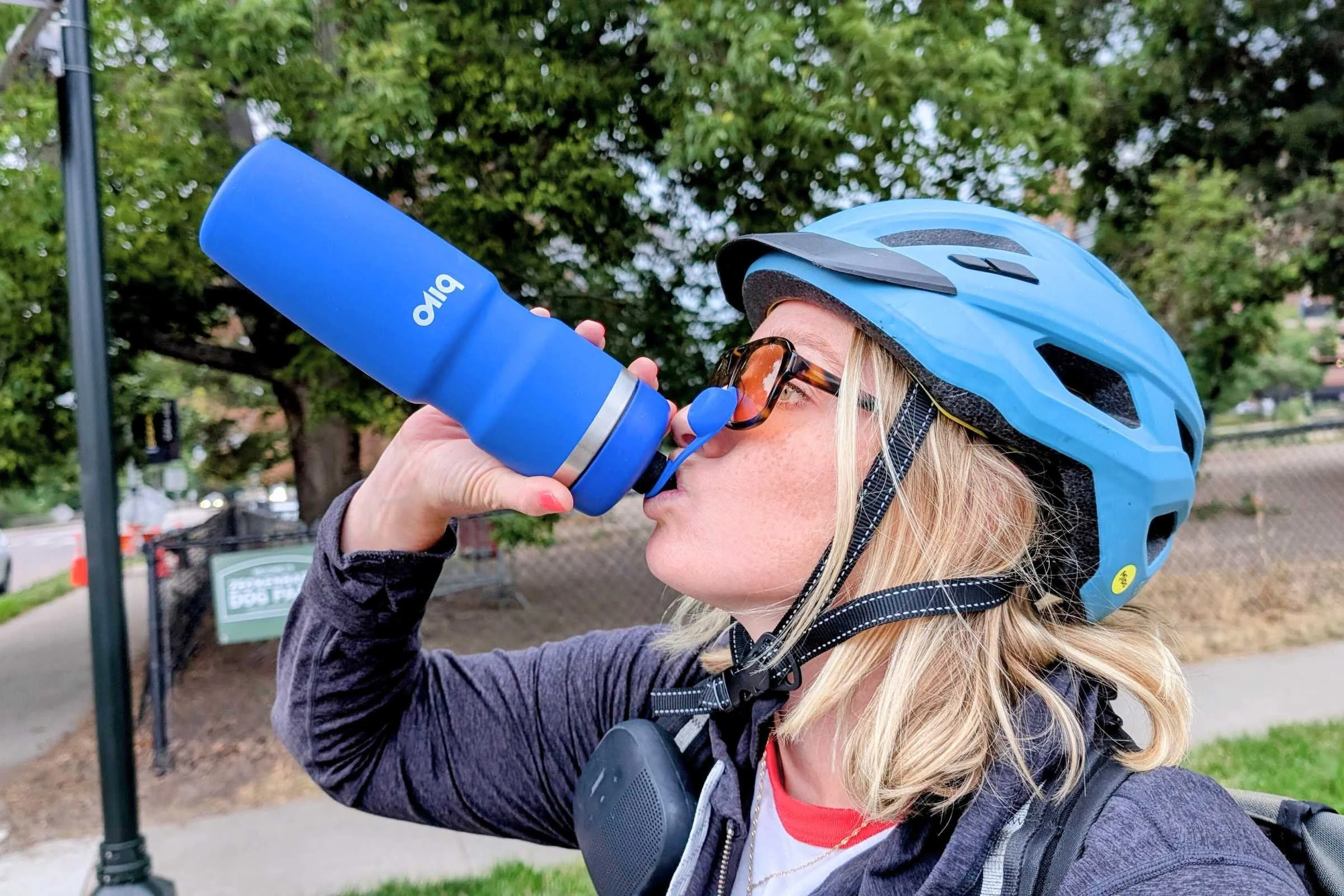 Biker drinking out of the Bivo Trio Bottle 21 oz insulated 