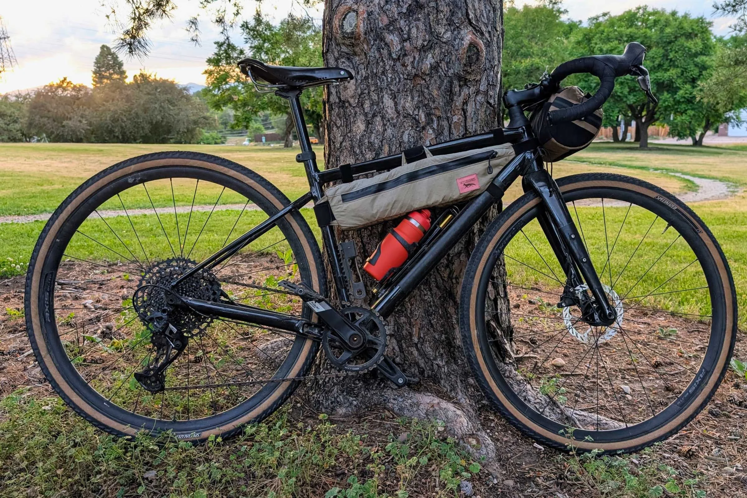 Bivo One Bottle 21 in the water bottle holder on a bike leaned up against a tree