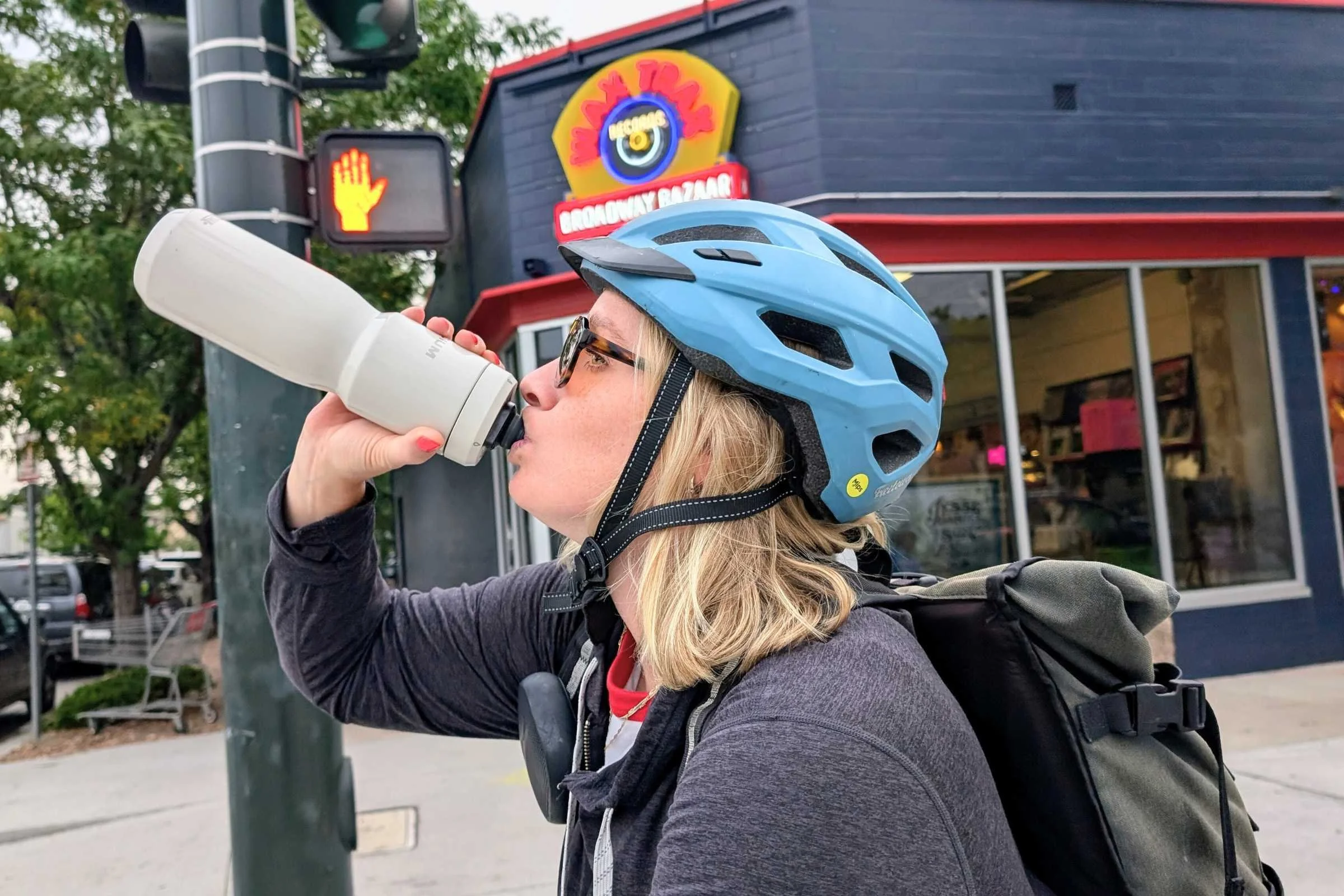 Biker drinking out of the Camelbak Podium Insulated Stainless Steel 22