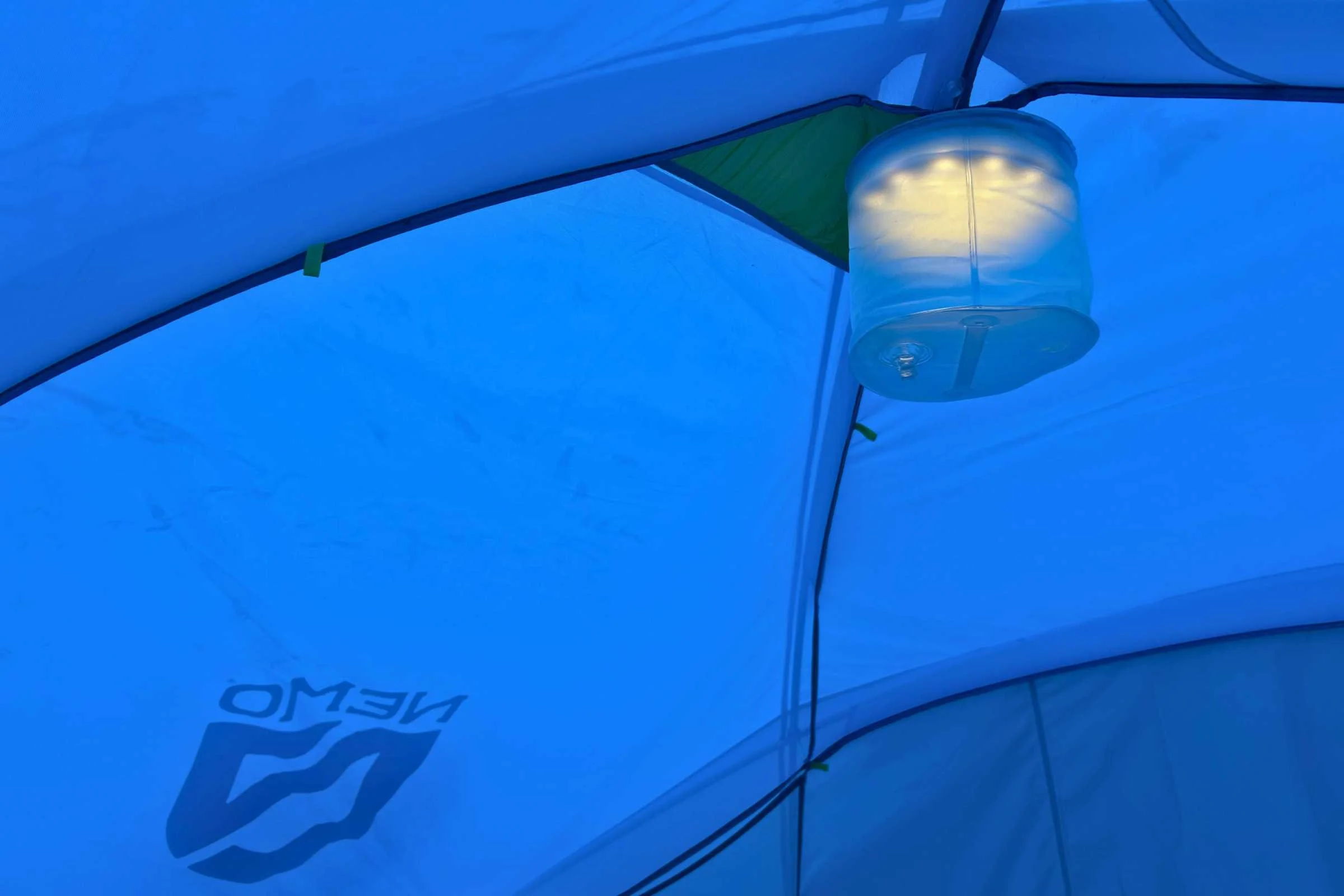 Light hanging from the ceiling of the NEMO Aurora Highrise camping tent