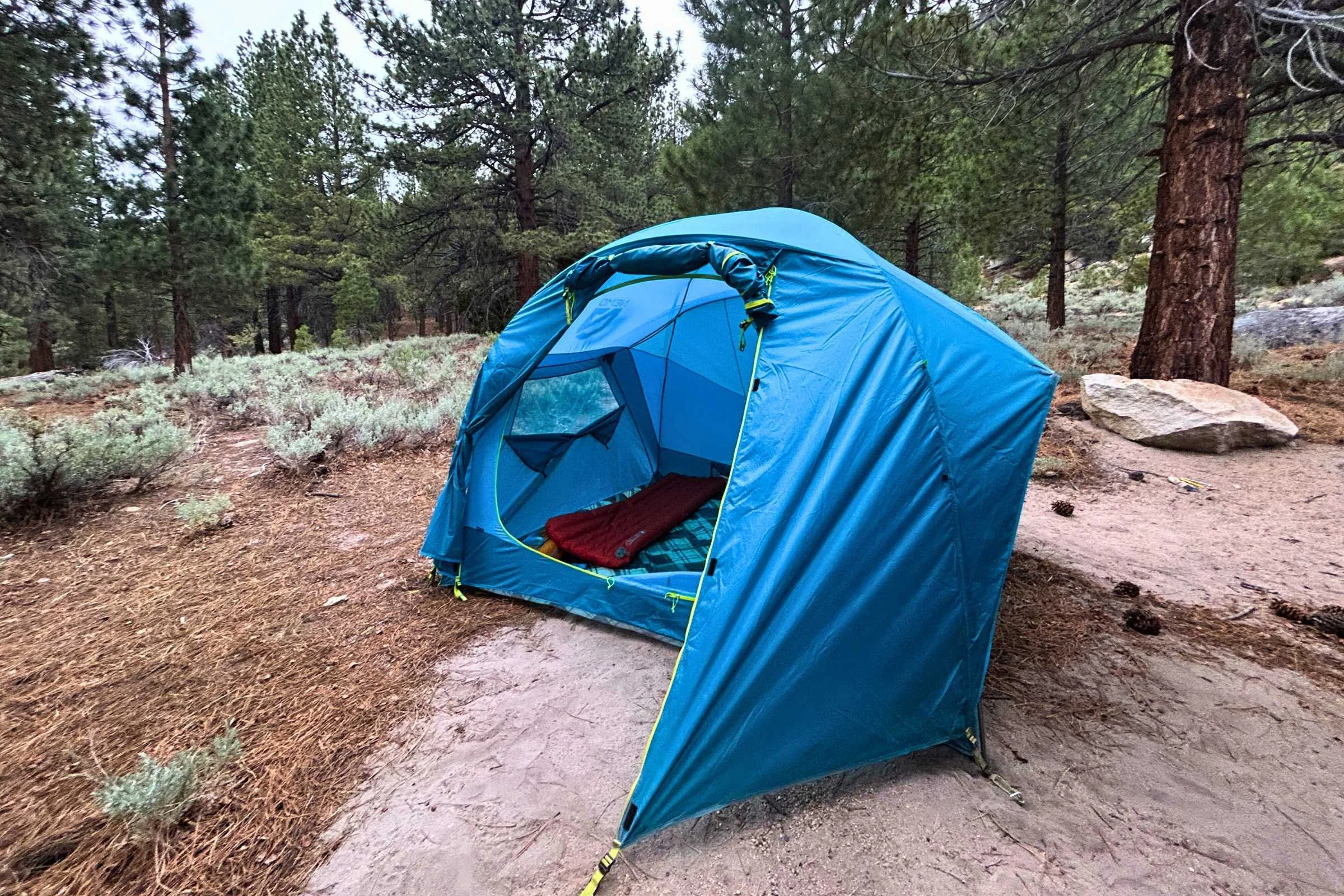 NEMO Aurora Highrise camping tent with half of the entry vestibule rolled up