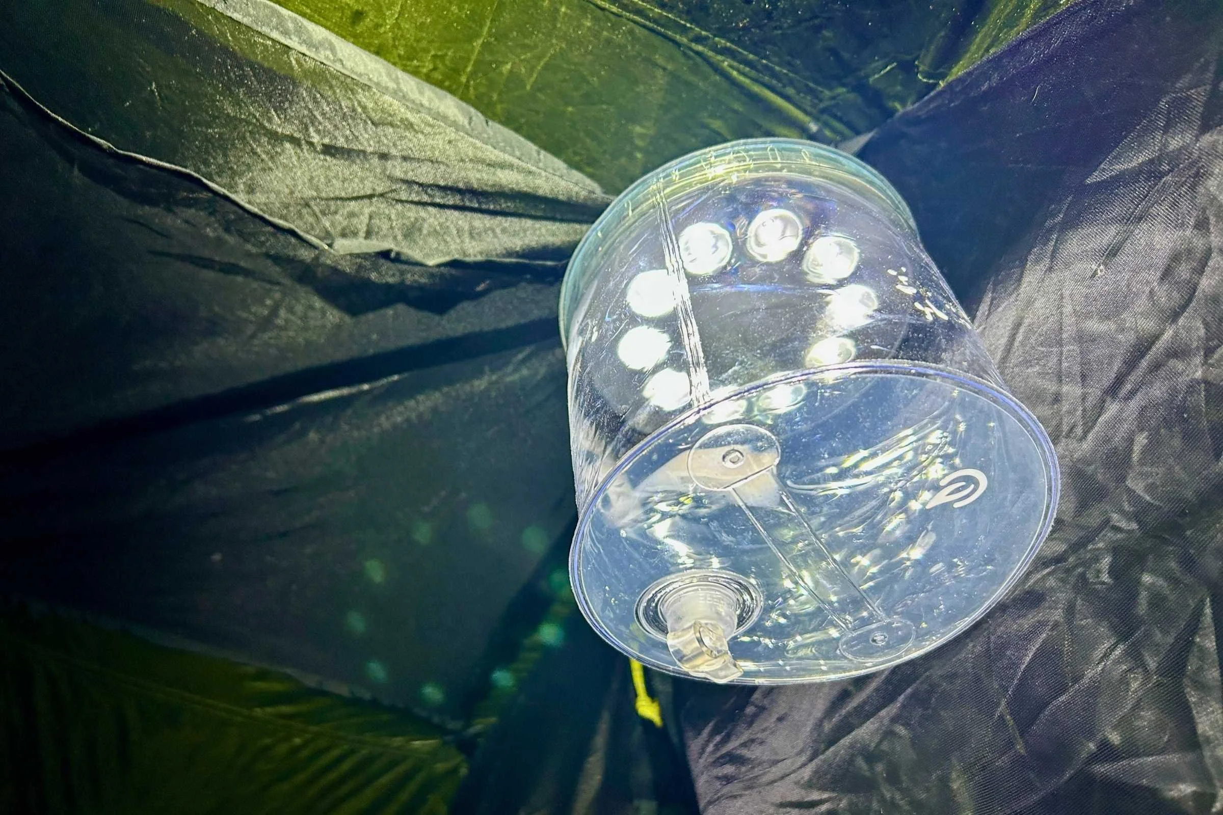 Luci inflatable lantern hanging from the top of a tent