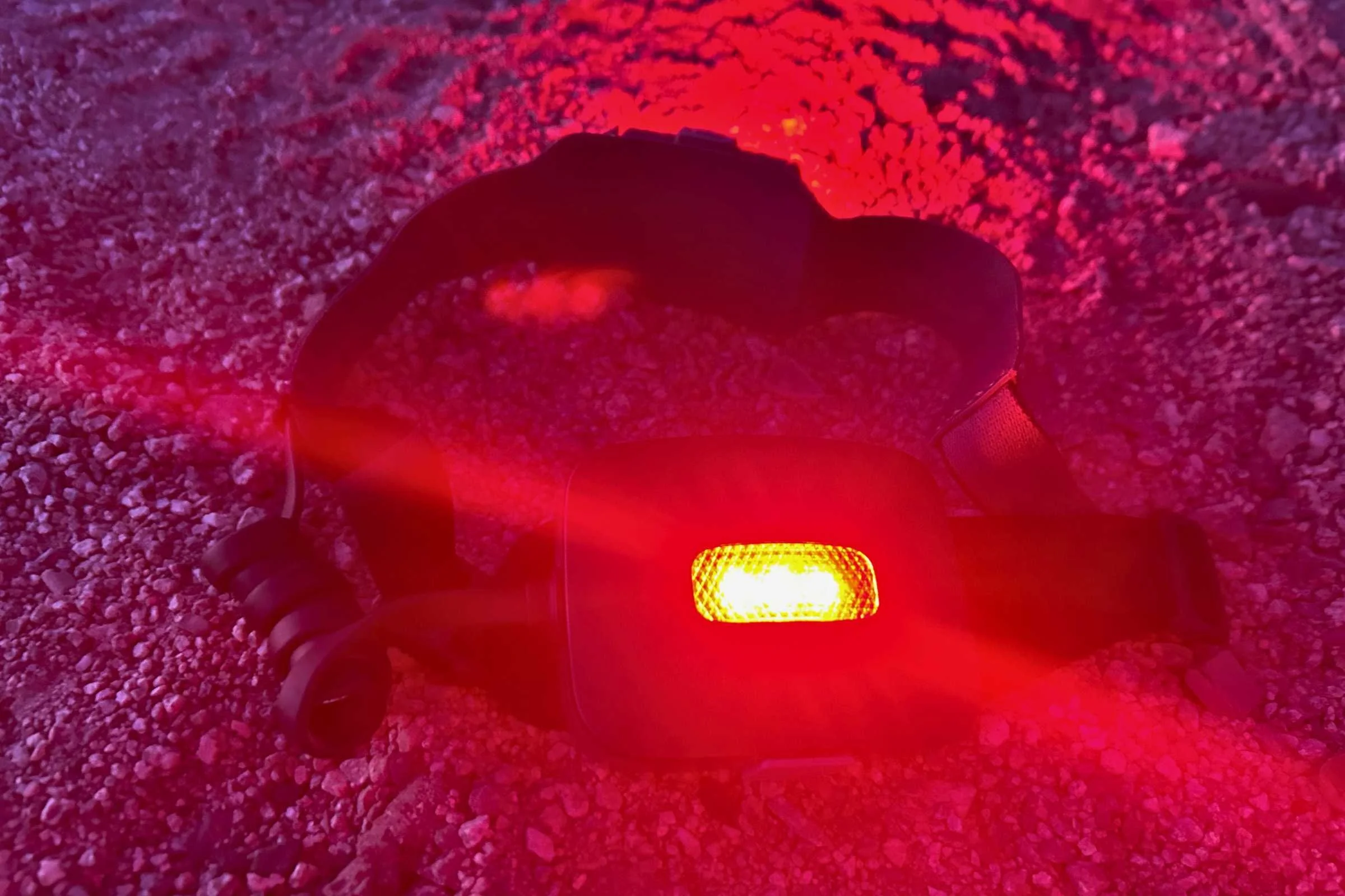 BioLite 800 Pro headlamp on the ground testing the brightness of the red light on at night