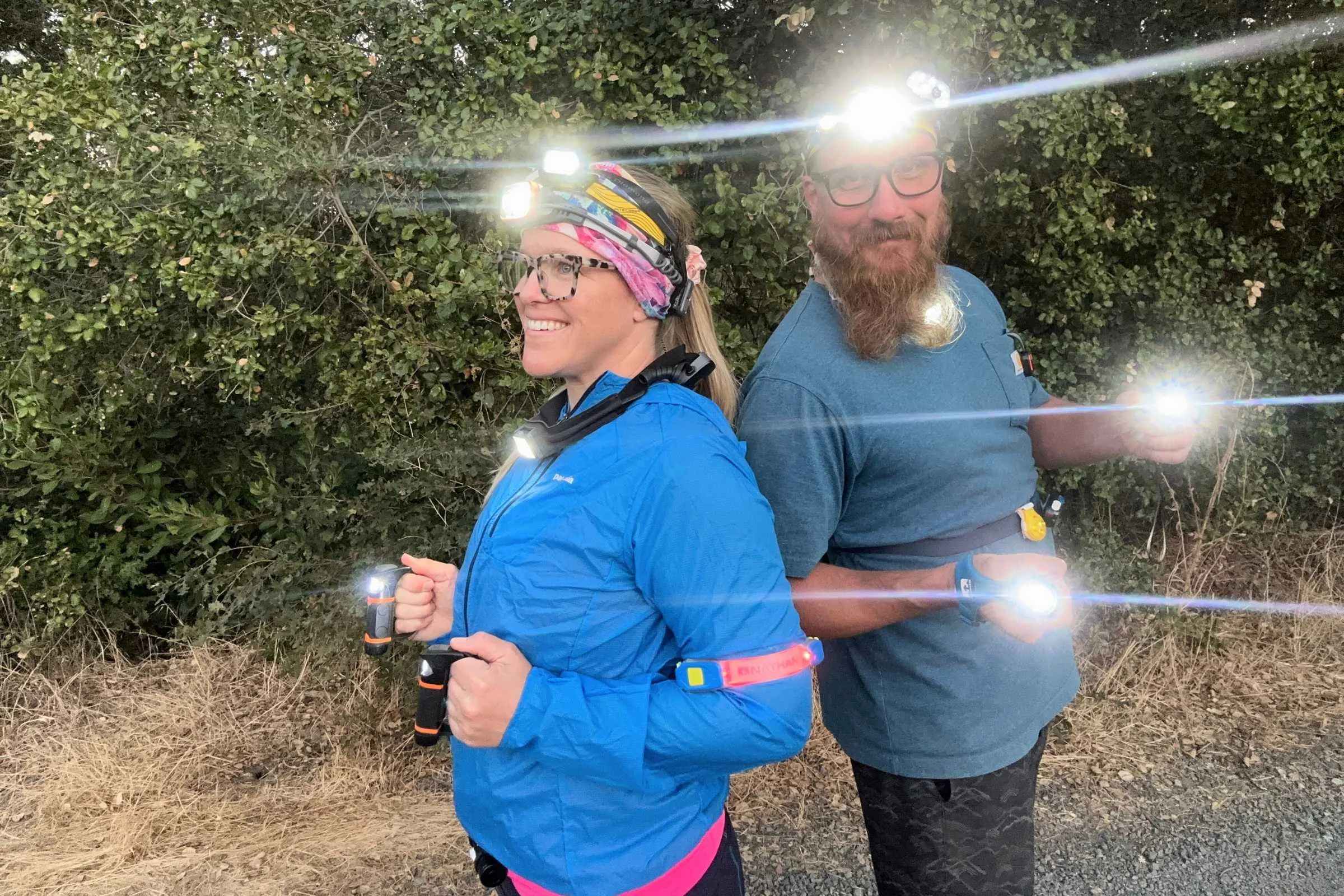 Two testers shining bright while testing many headlamps including the BioLite 800 Pro
